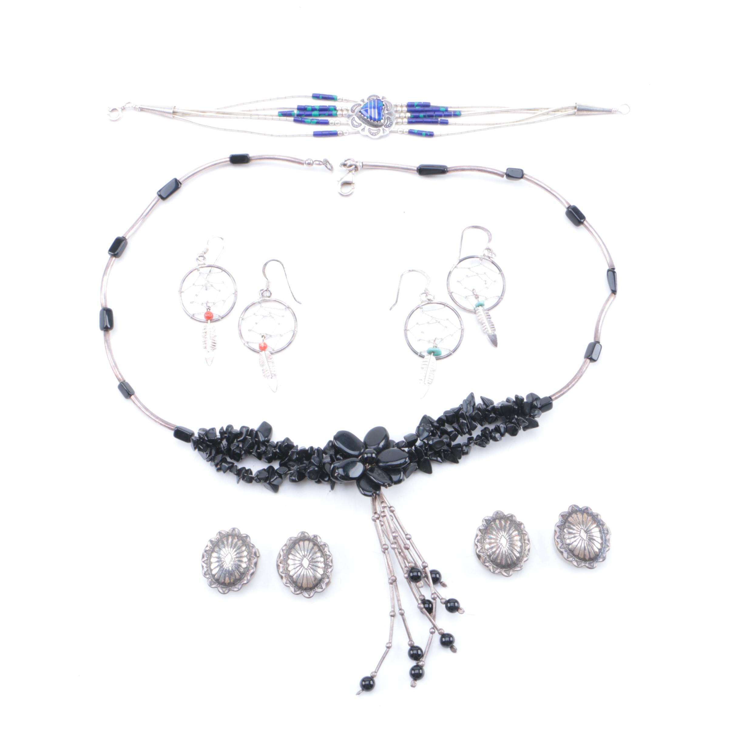 Assortment of Silver Tone Jewelry Including Obsidian, Glass, and Coral