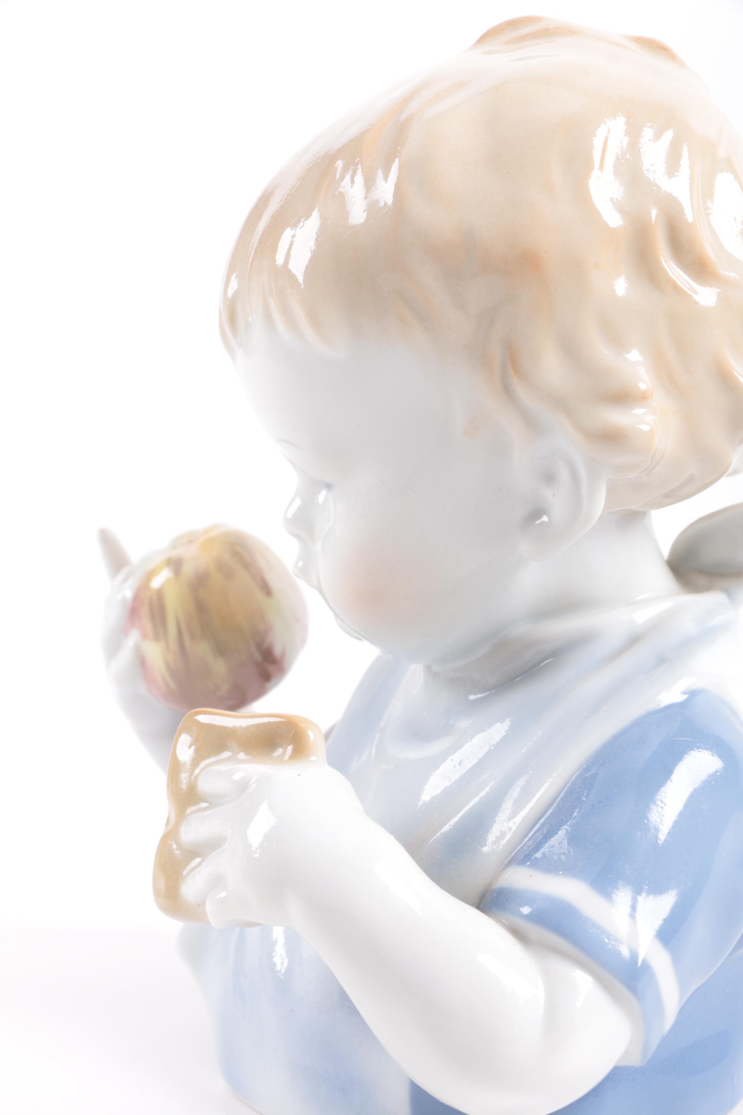 German Porcelain Figurine of a Young Child