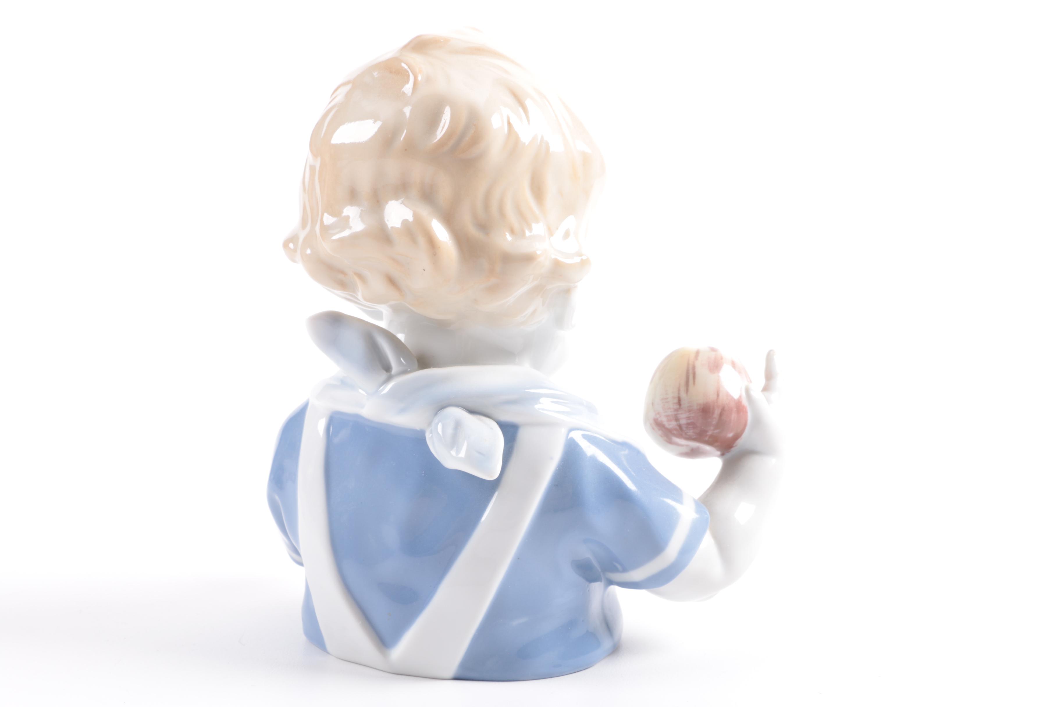 German Porcelain Figurine of a Young Child