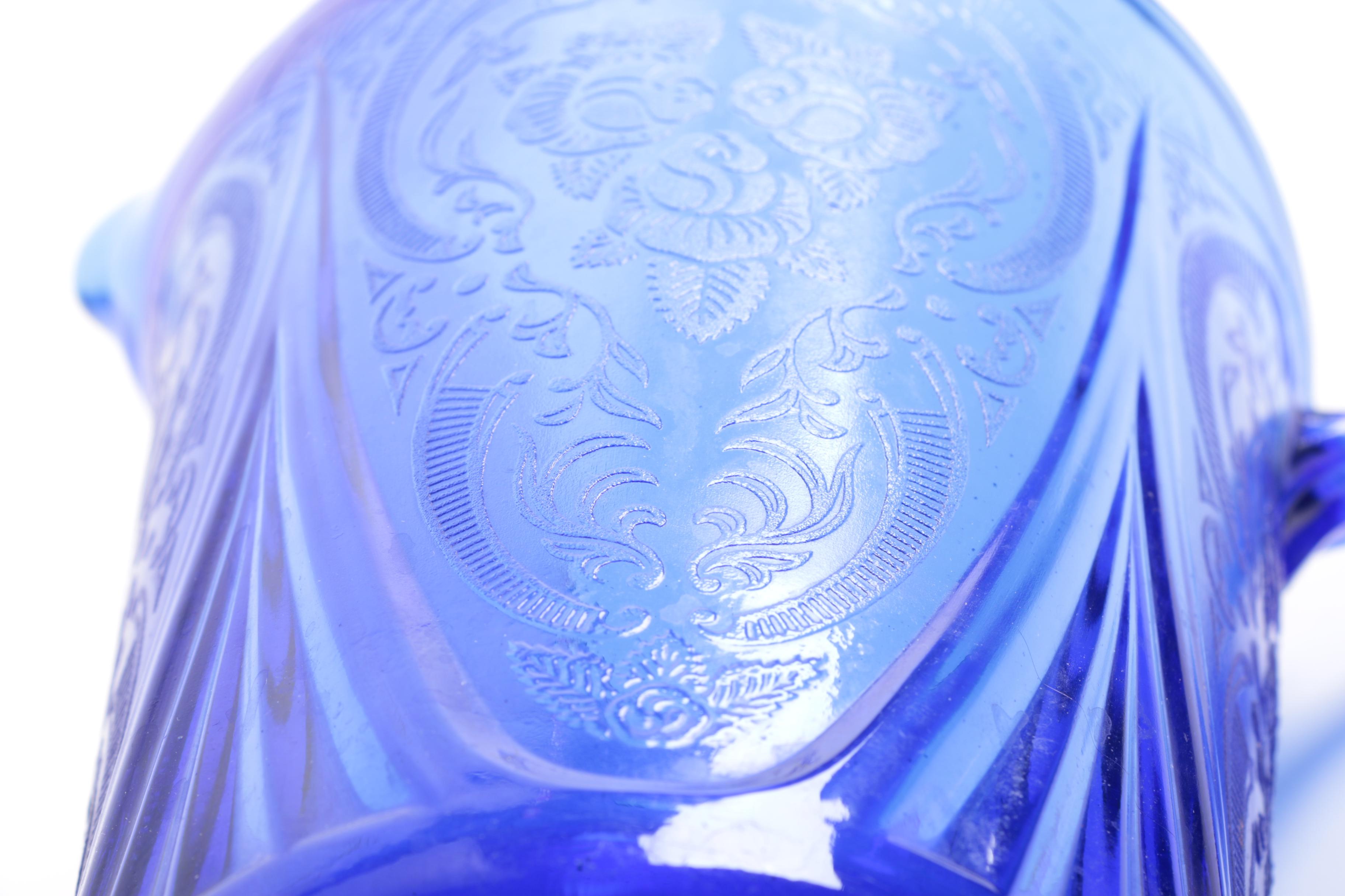 Pressed Blue Glass Rose and Scrolled Foliate Motif Pitcher