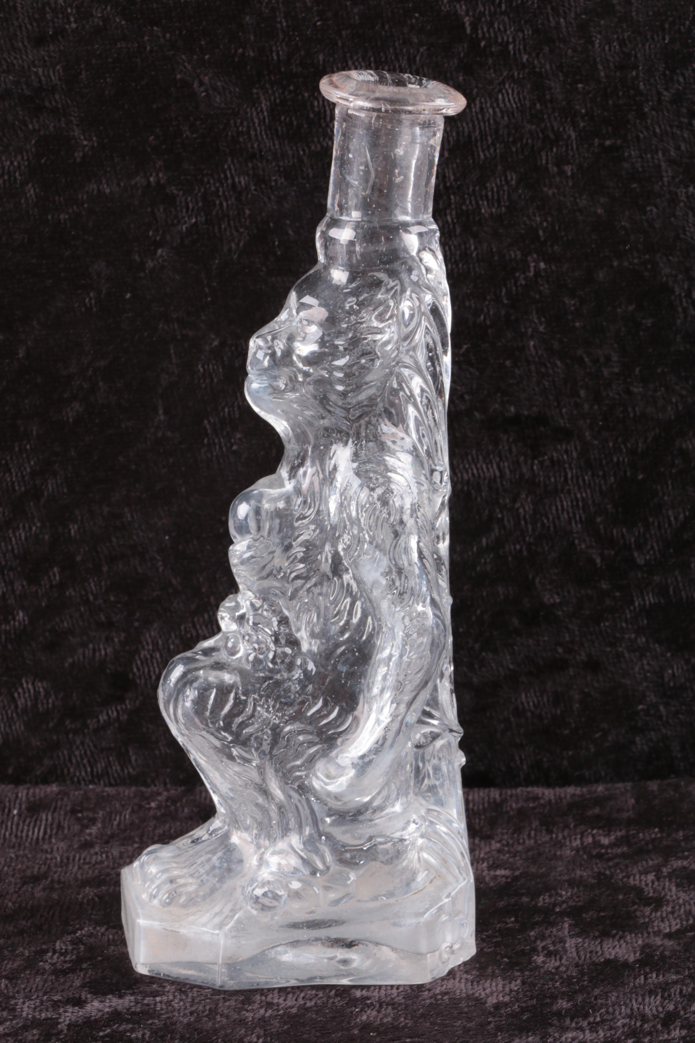 Molded Glass Lion Bottle