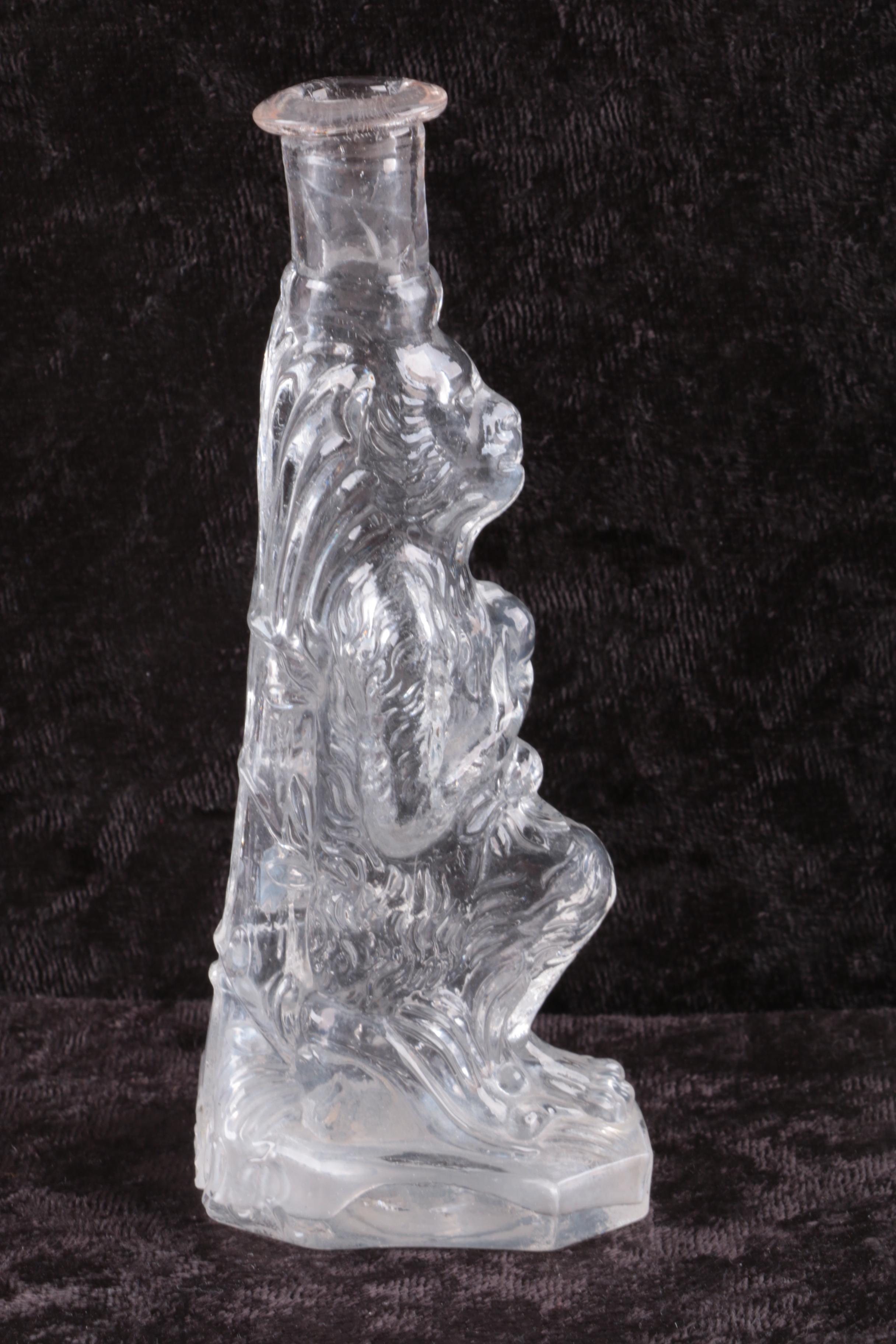 Molded Glass Lion Bottle