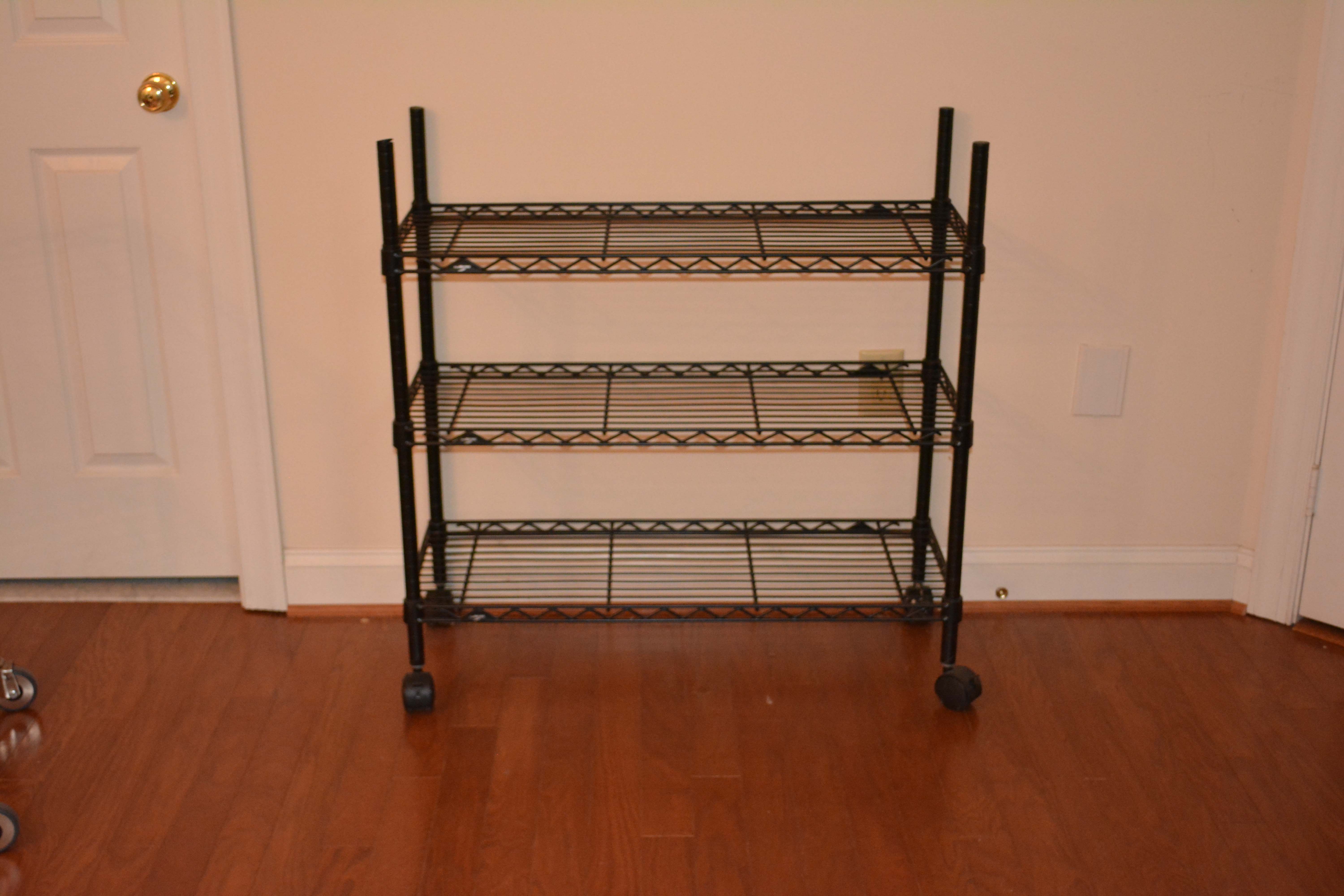 Three Black InterMetro Rolling Shelving and Cart