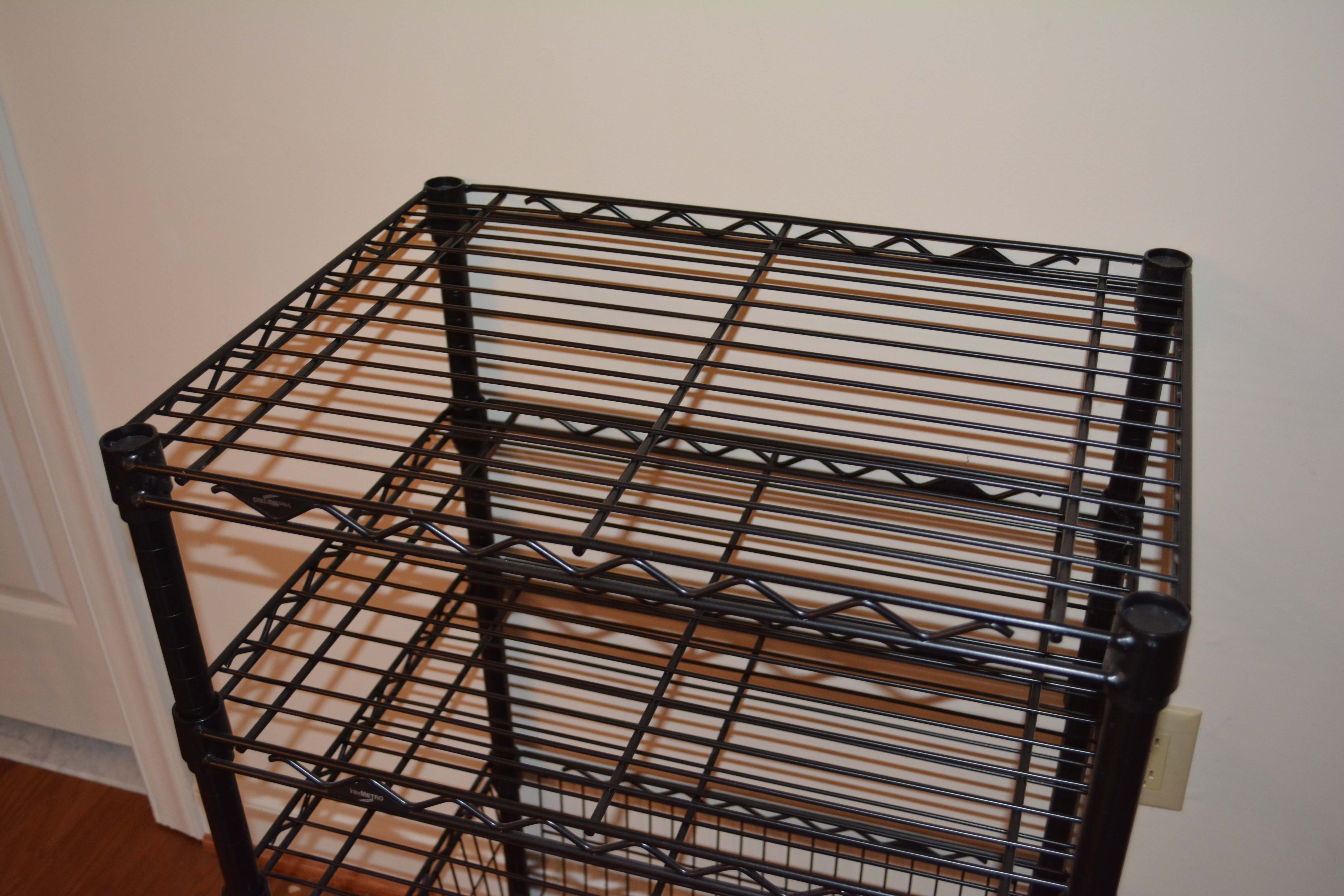 Three Black InterMetro Rolling Shelving and Cart