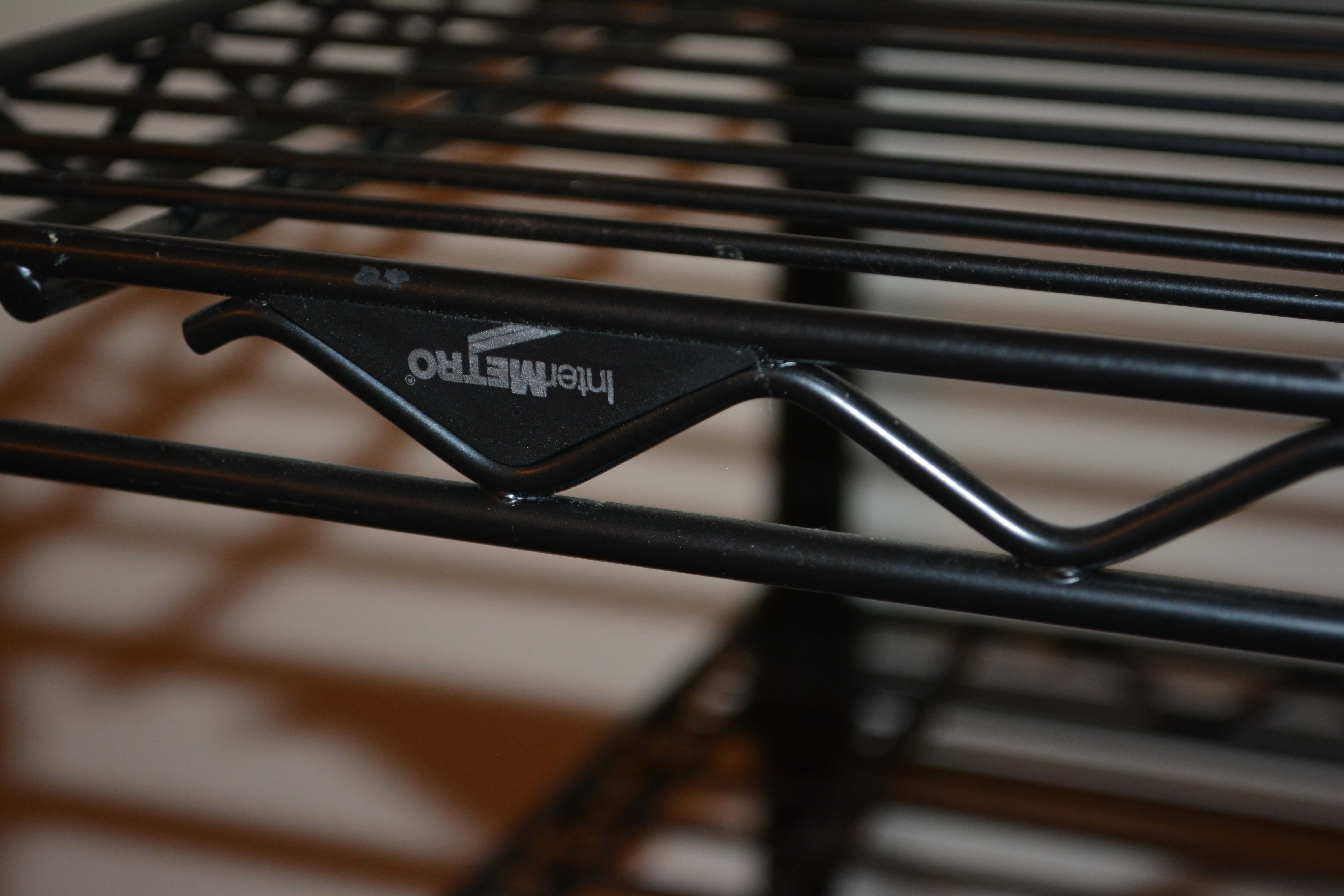 Three Black InterMetro Rolling Shelving and Cart