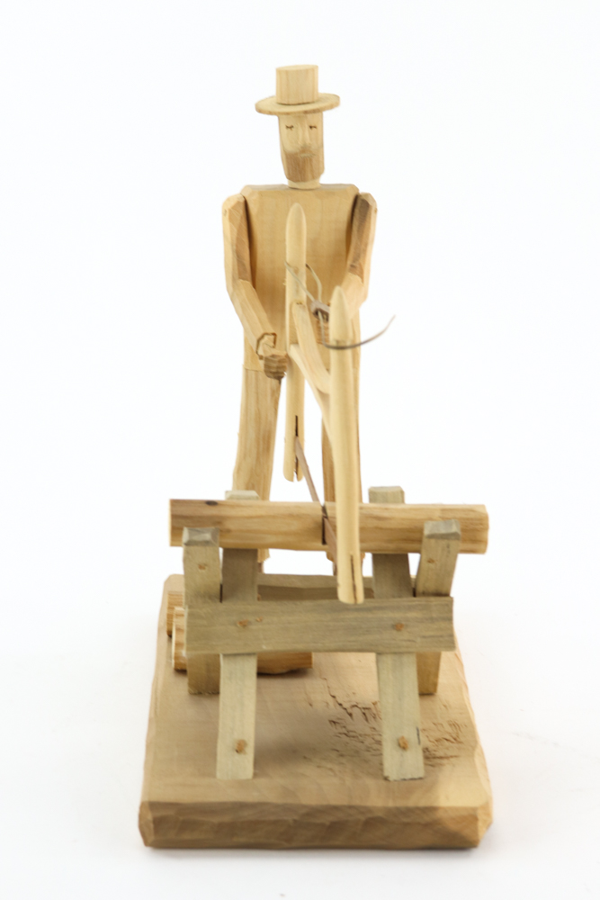 Donnie Brown Wood Sculpture of Man with Saw