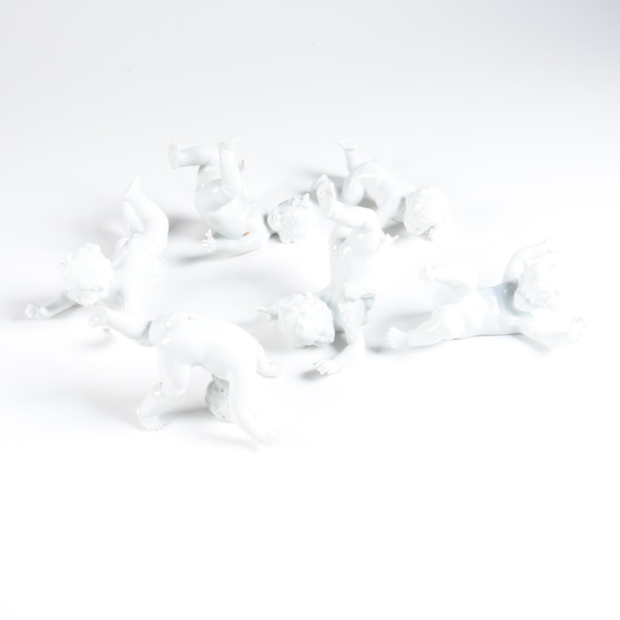 Porcelain Tumbling Cherub Figurines Featuring Unterweissbach