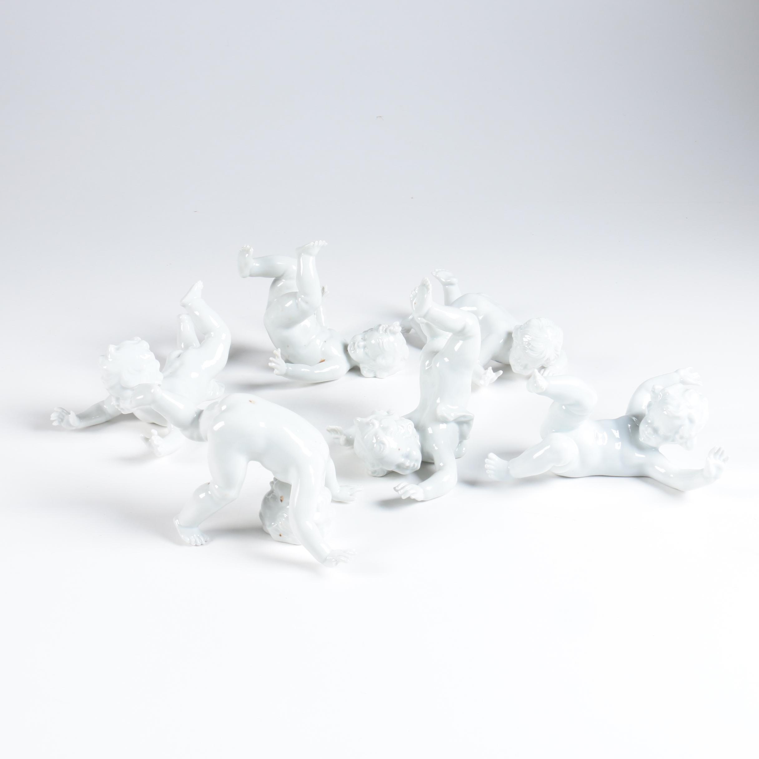 Porcelain Tumbling Cherub Figurines Featuring Unterweissbach