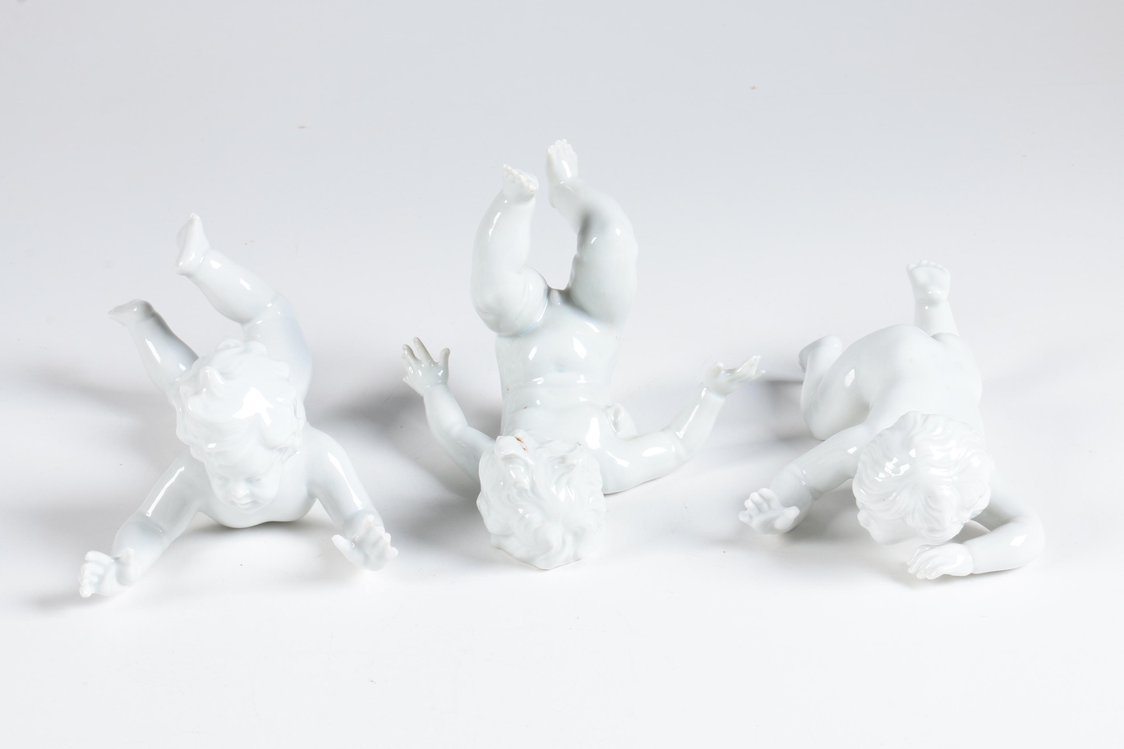 Porcelain Tumbling Cherub Figurines Featuring Unterweissbach