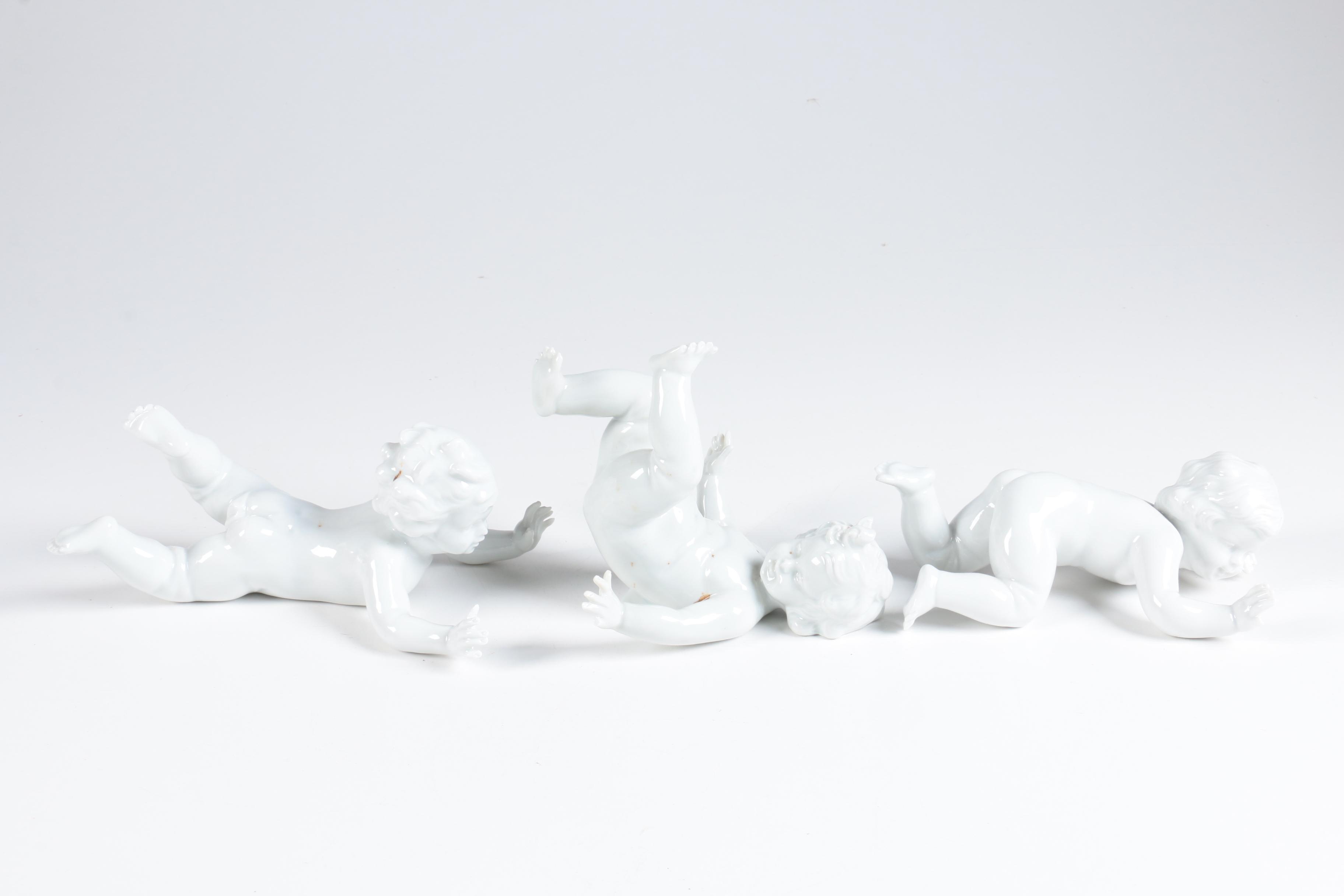 Porcelain Tumbling Cherub Figurines Featuring Unterweissbach
