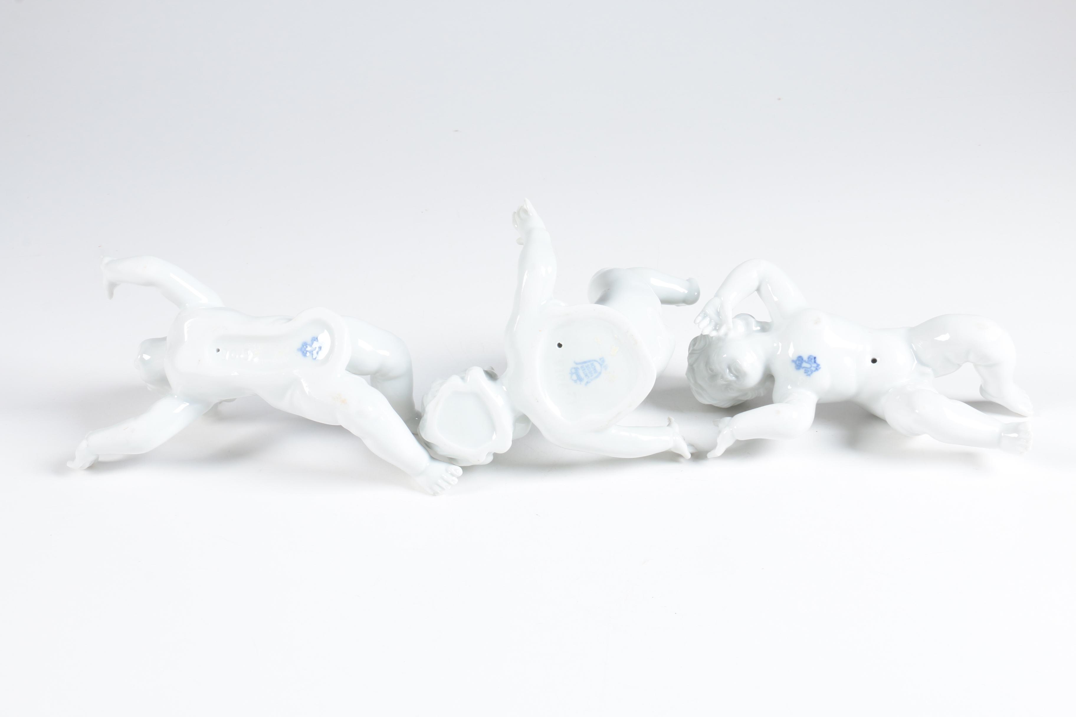 Porcelain Tumbling Cherub Figurines Featuring Unterweissbach
