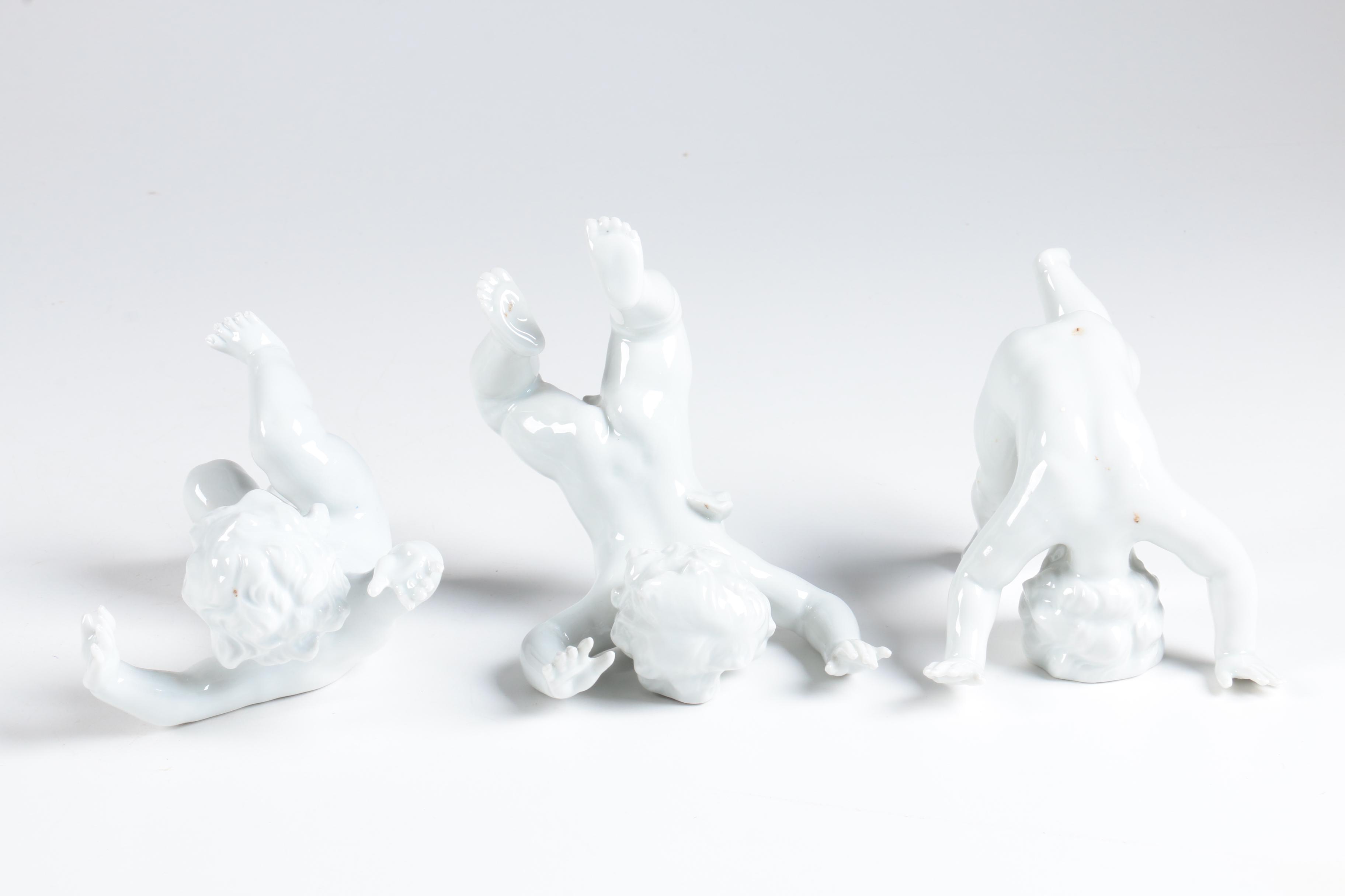 Porcelain Tumbling Cherub Figurines Featuring Unterweissbach
