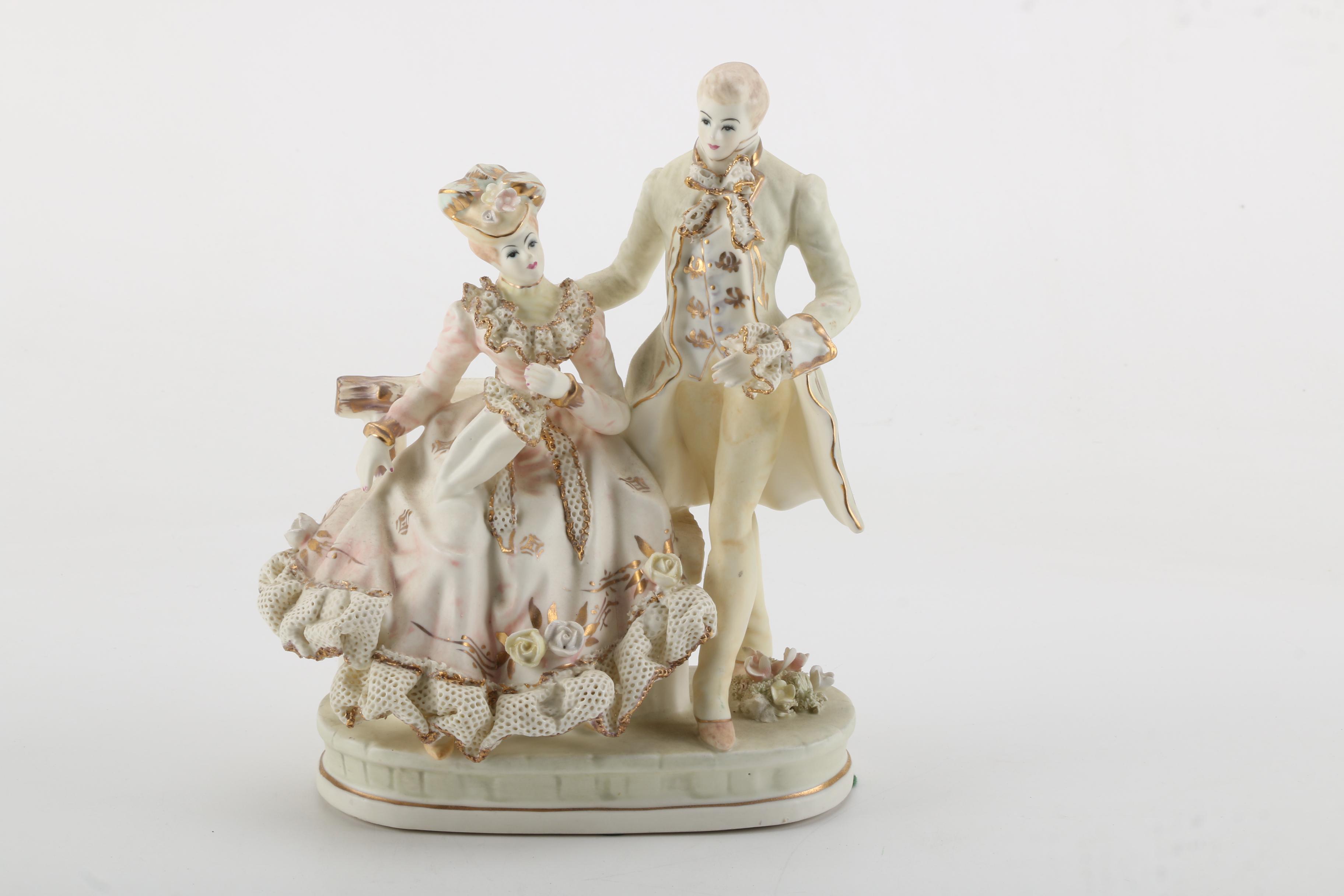 Porcelain Figurines of Men, Women, and Children