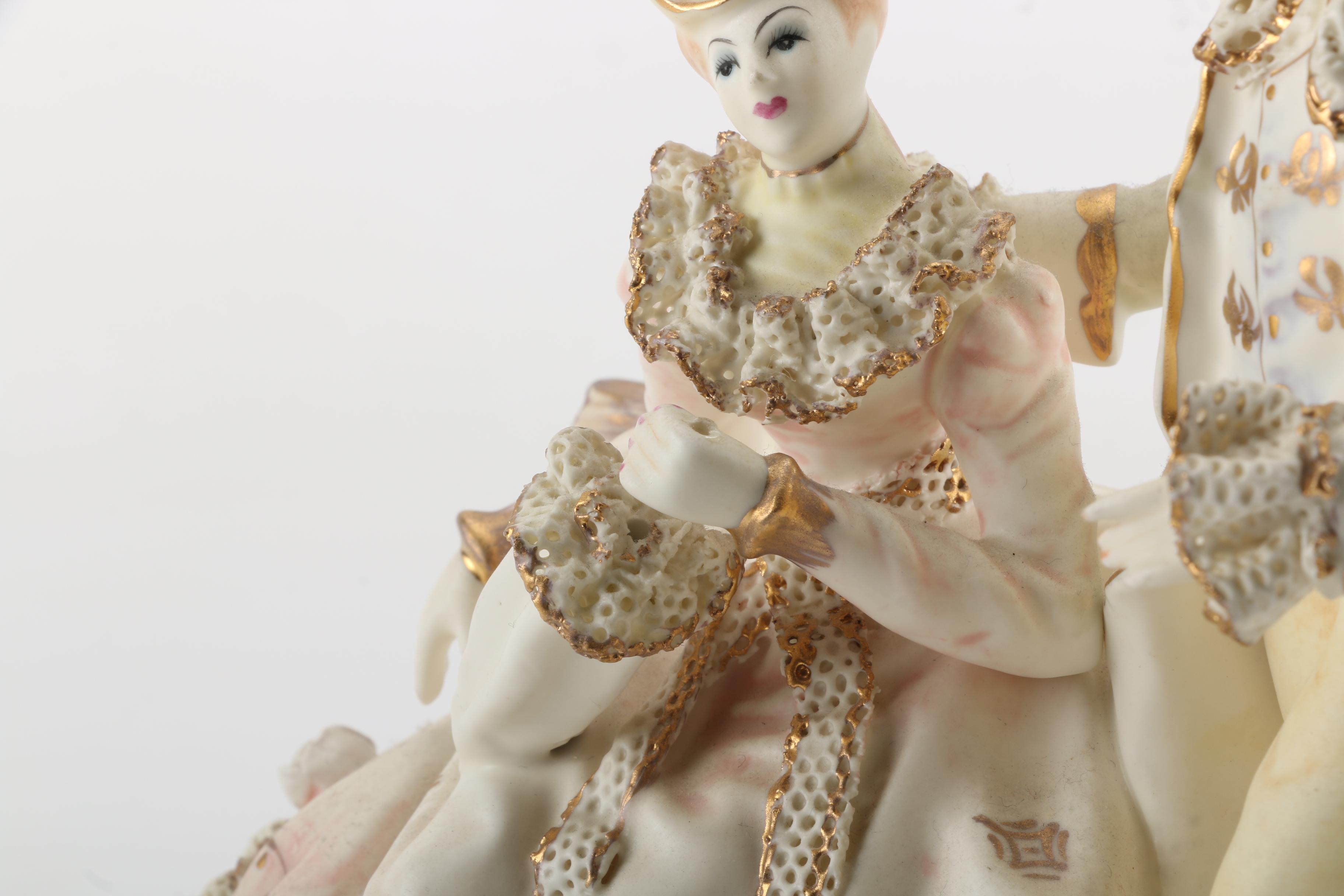 Porcelain Figurines of Men, Women, and Children