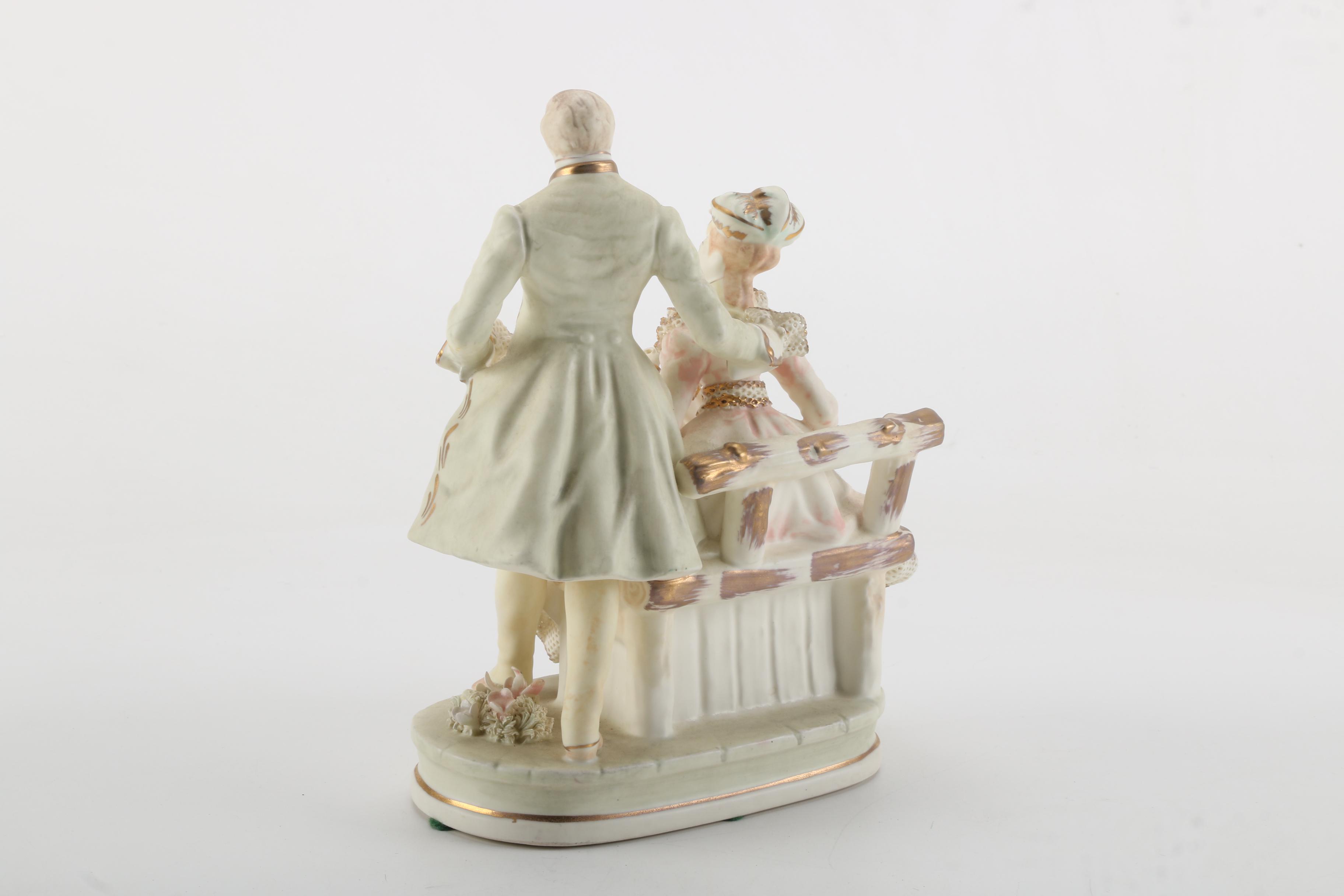 Porcelain Figurines of Men, Women, and Children