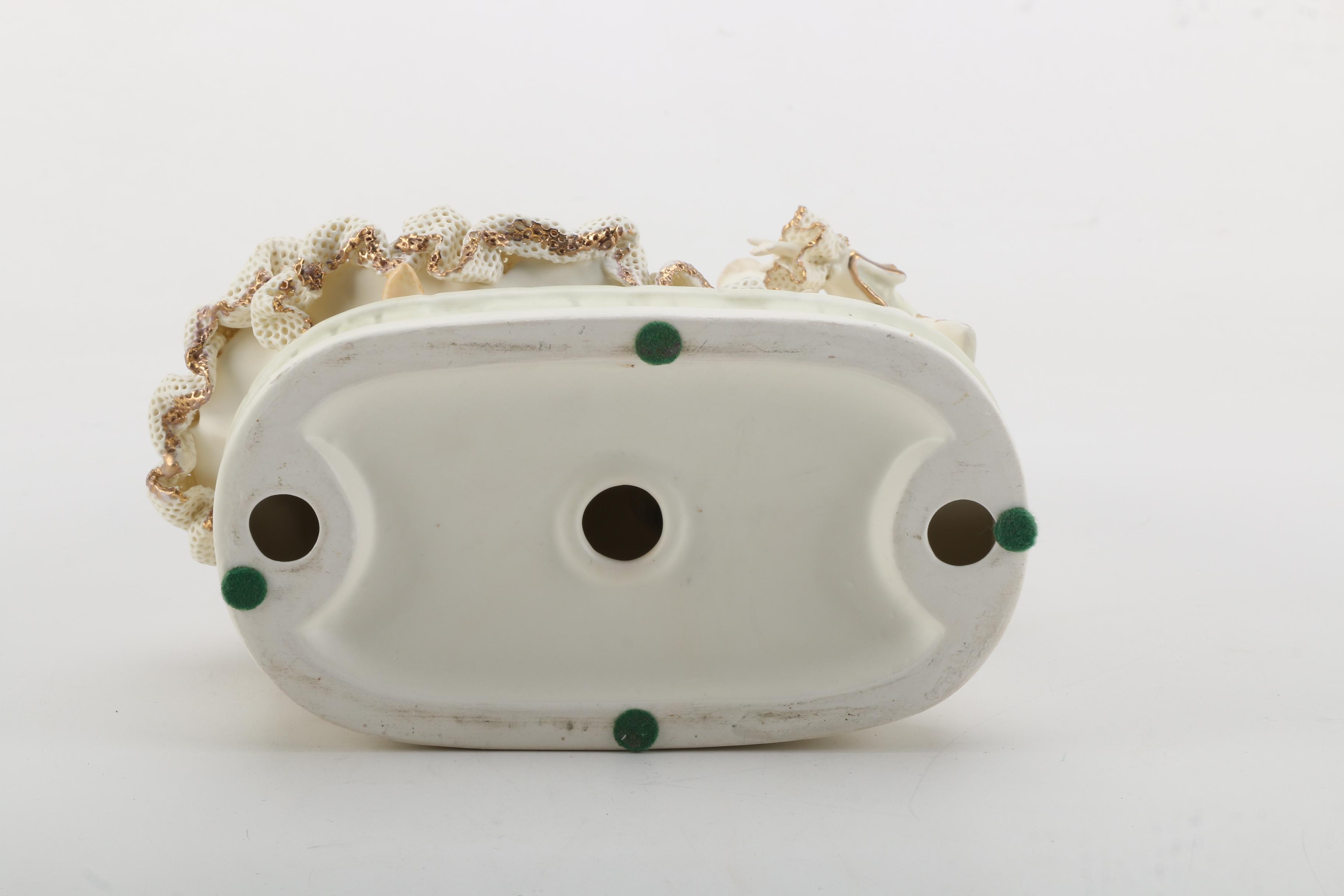 Porcelain Figurines of Men, Women, and Children