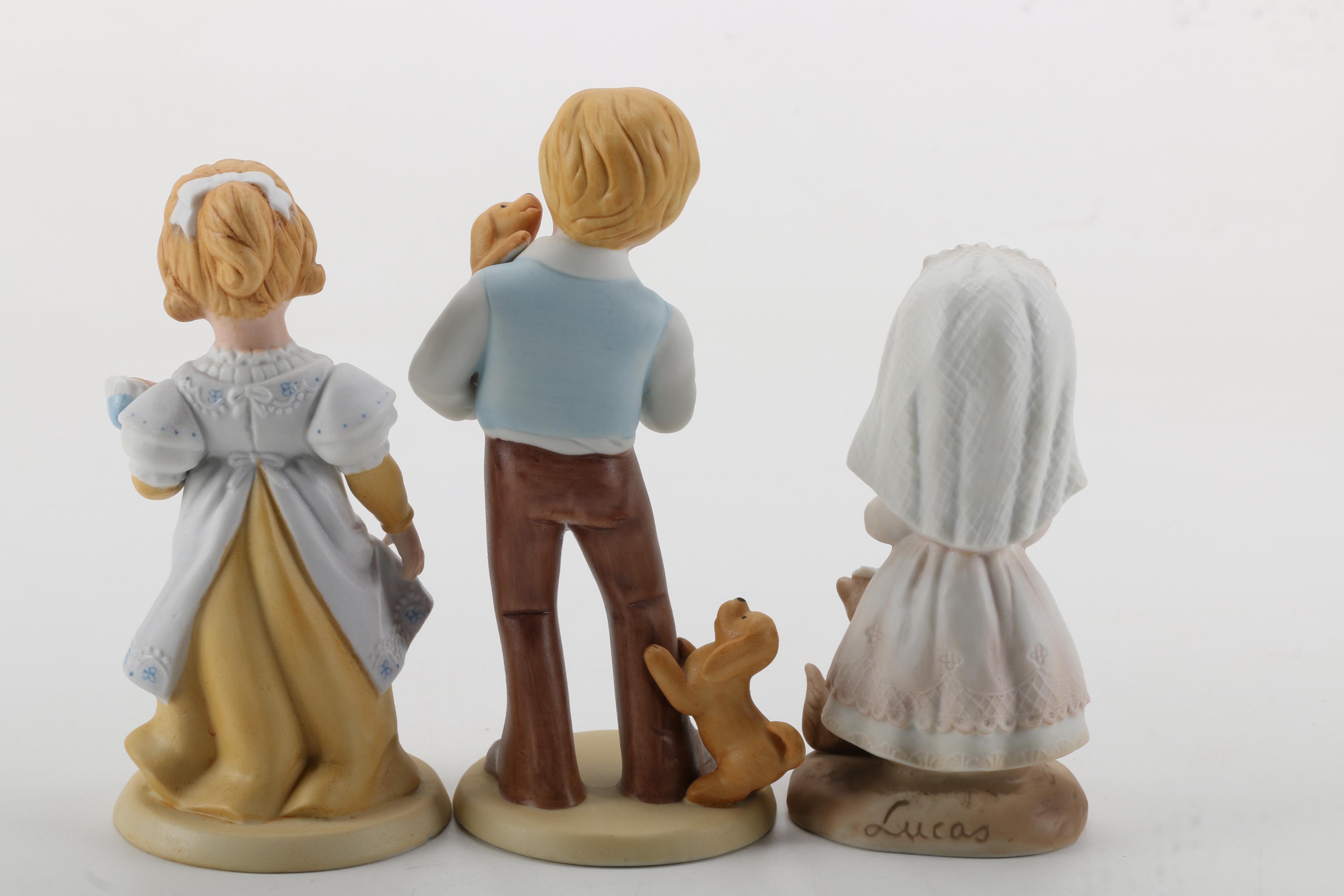 Porcelain Figurines of Men, Women, and Children