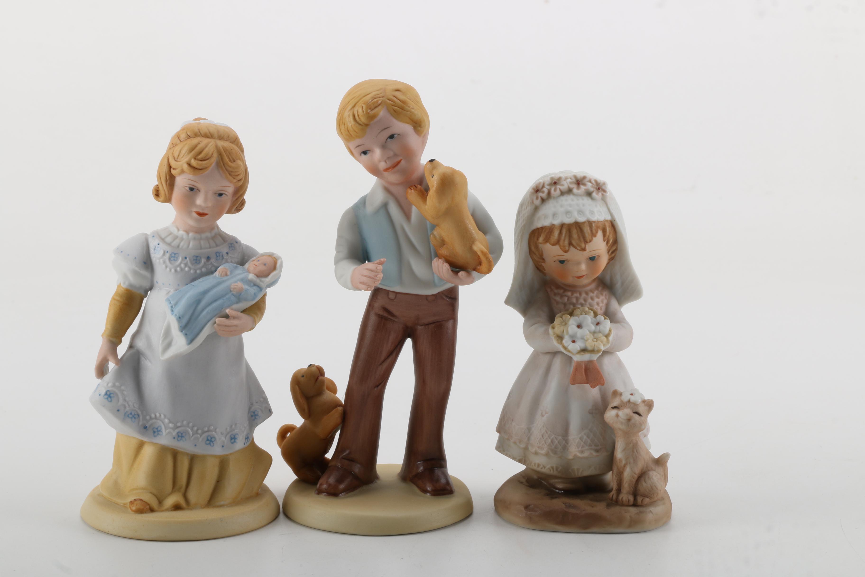 Porcelain Figurines of Men, Women, and Children