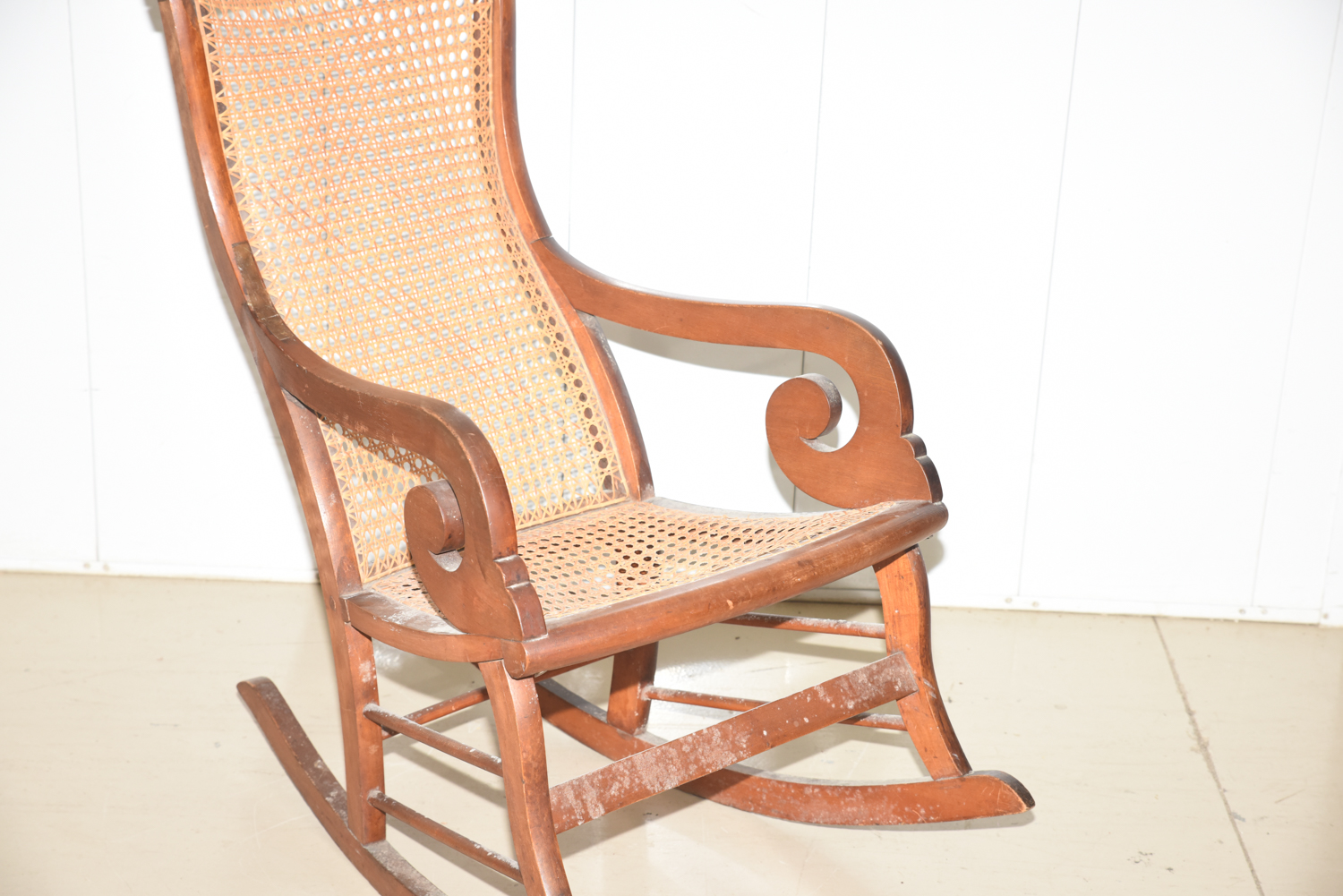 Wooden Cane Backed Rocking Chair by P. Gustine