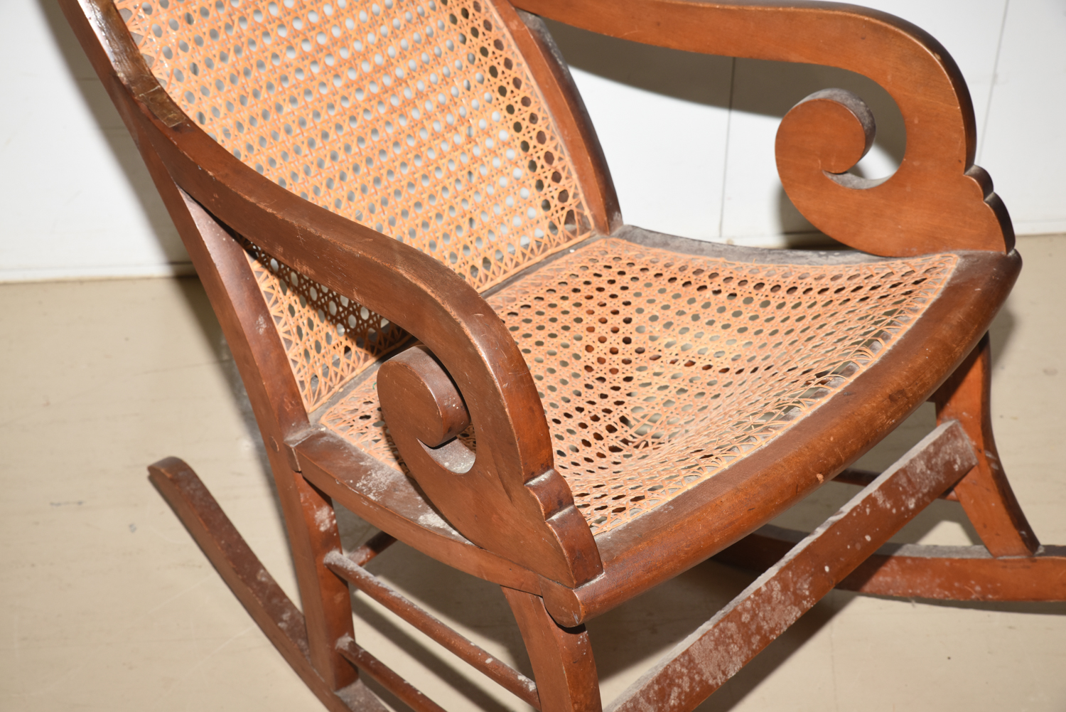 Wooden Cane Backed Rocking Chair by P. Gustine