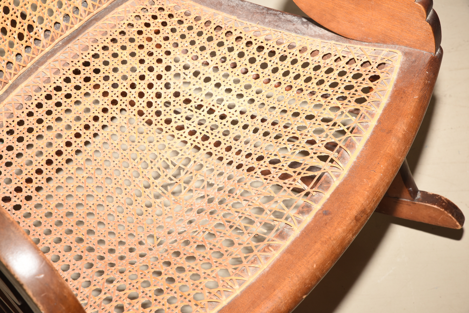 Wooden Cane Backed Rocking Chair by P. Gustine