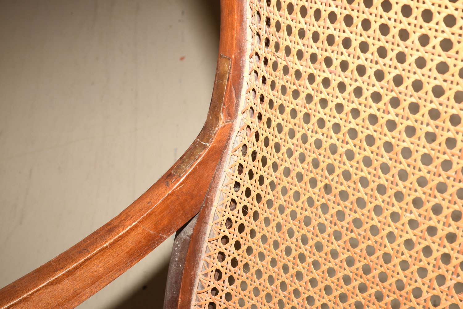 Wooden Cane Backed Rocking Chair by P. Gustine