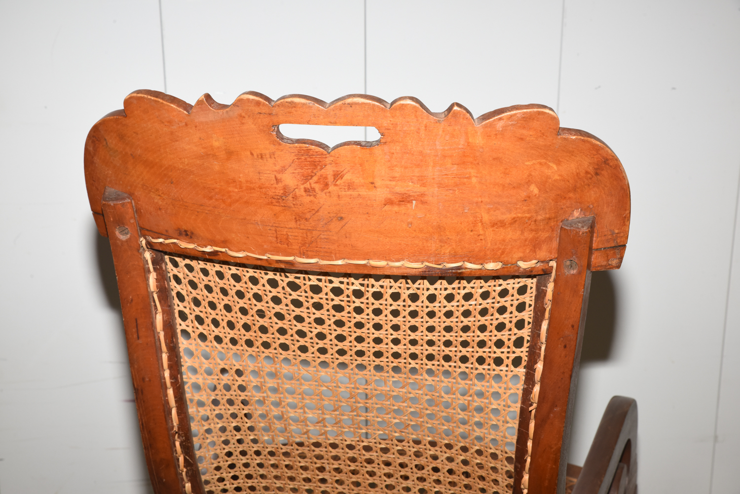 Wooden Cane Backed Rocking Chair by P. Gustine