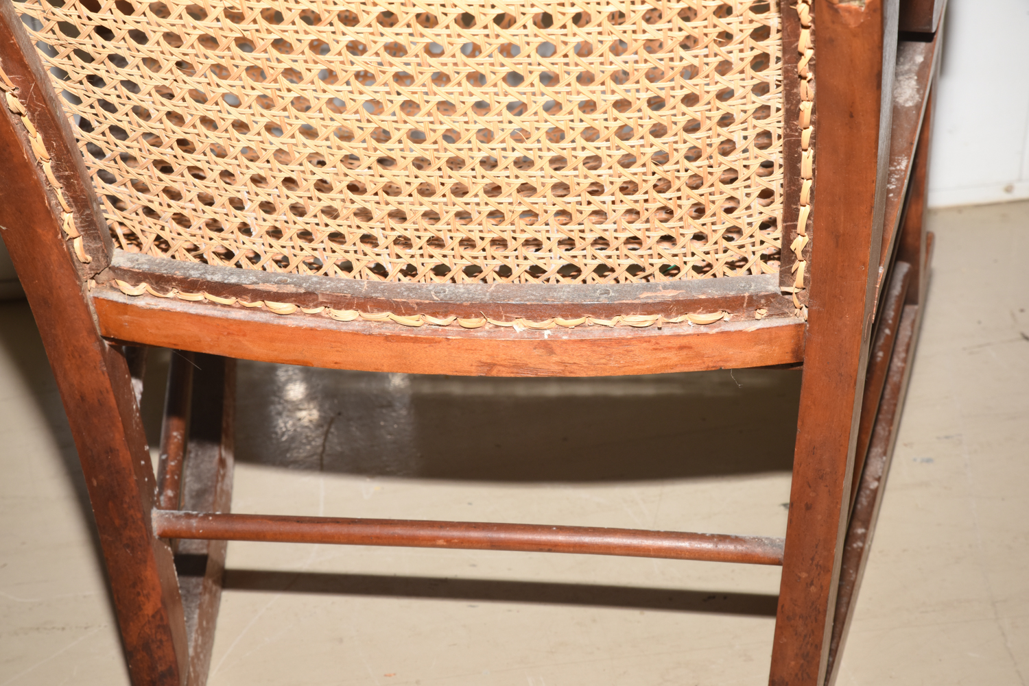 Wooden Cane Backed Rocking Chair by P. Gustine