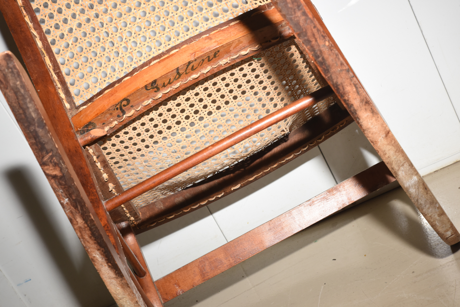 Wooden Cane Backed Rocking Chair by P. Gustine