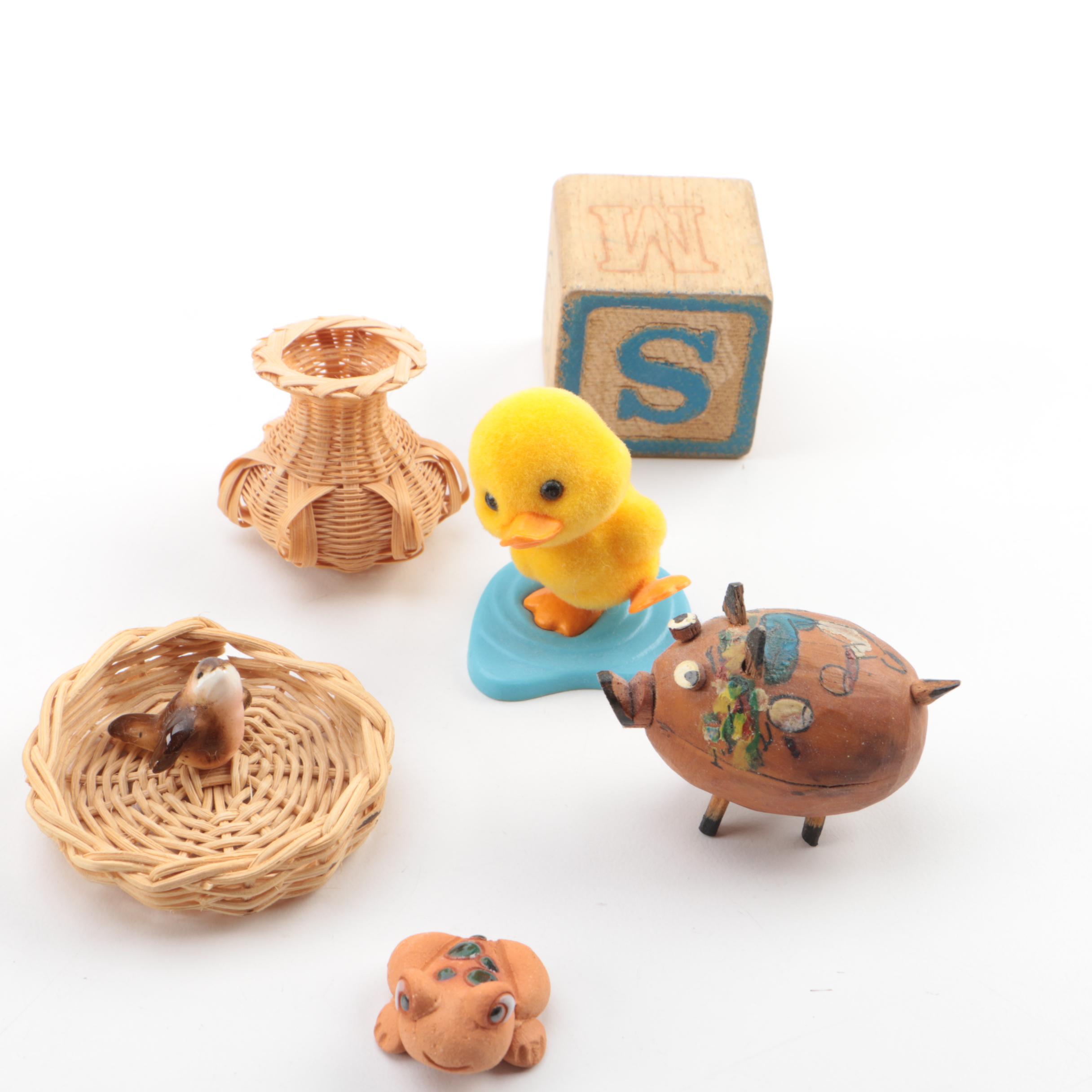 Vintage Figurines Featuring Goebel and a Display Shelf