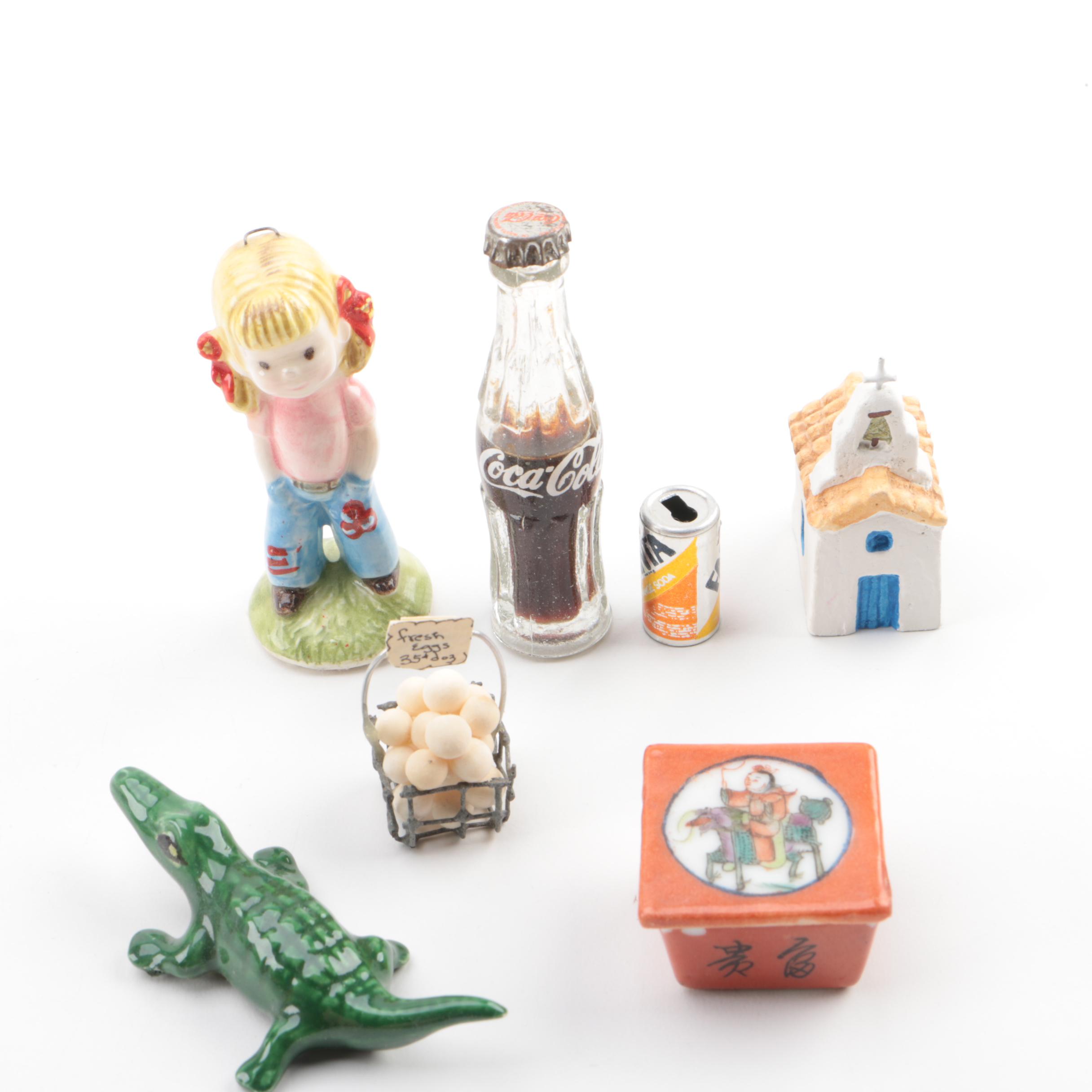 Vintage Figurines Featuring Goebel and a Display Shelf