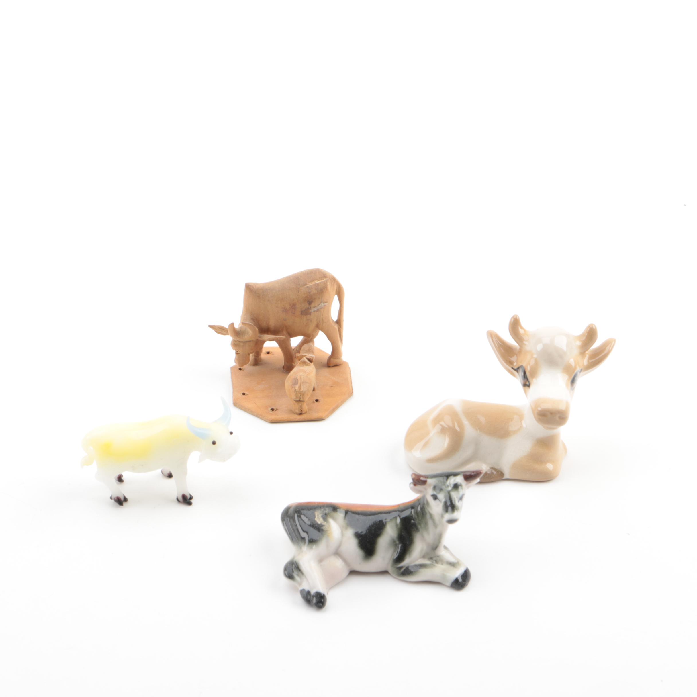 Vintage Figurines Featuring Goebel and a Display Shelf