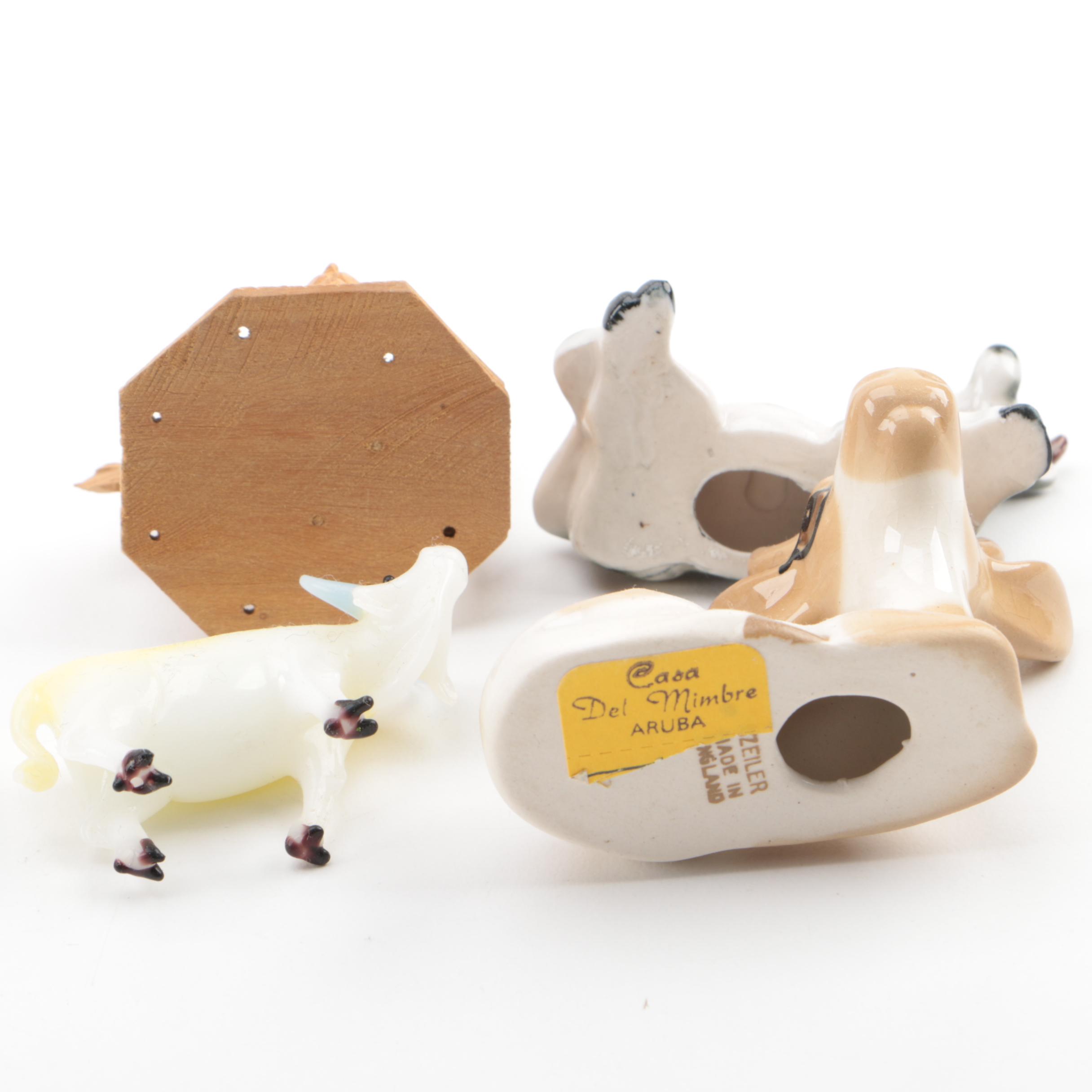 Vintage Figurines Featuring Goebel and a Display Shelf