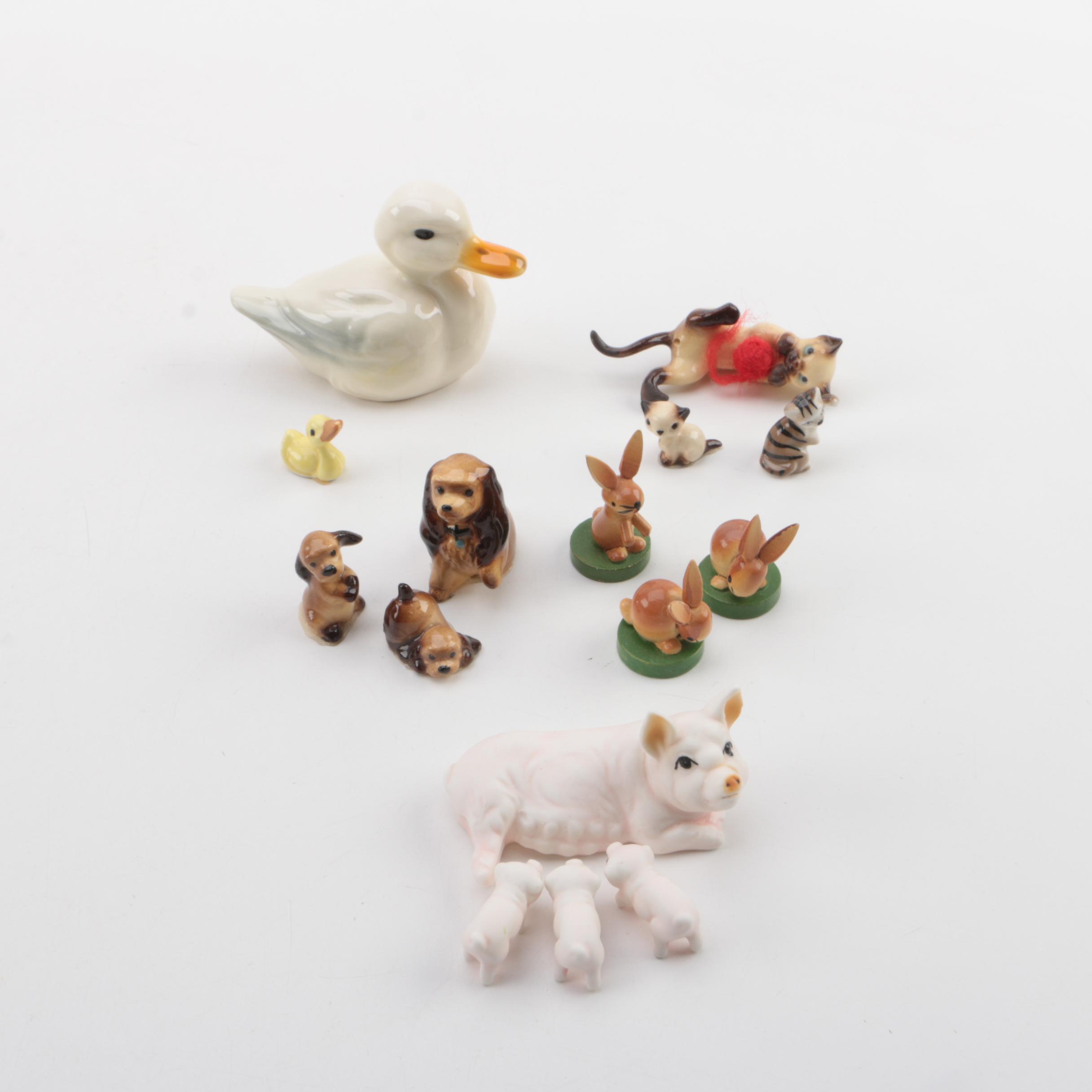 Vintage Figurines Featuring Goebel and a Display Shelf