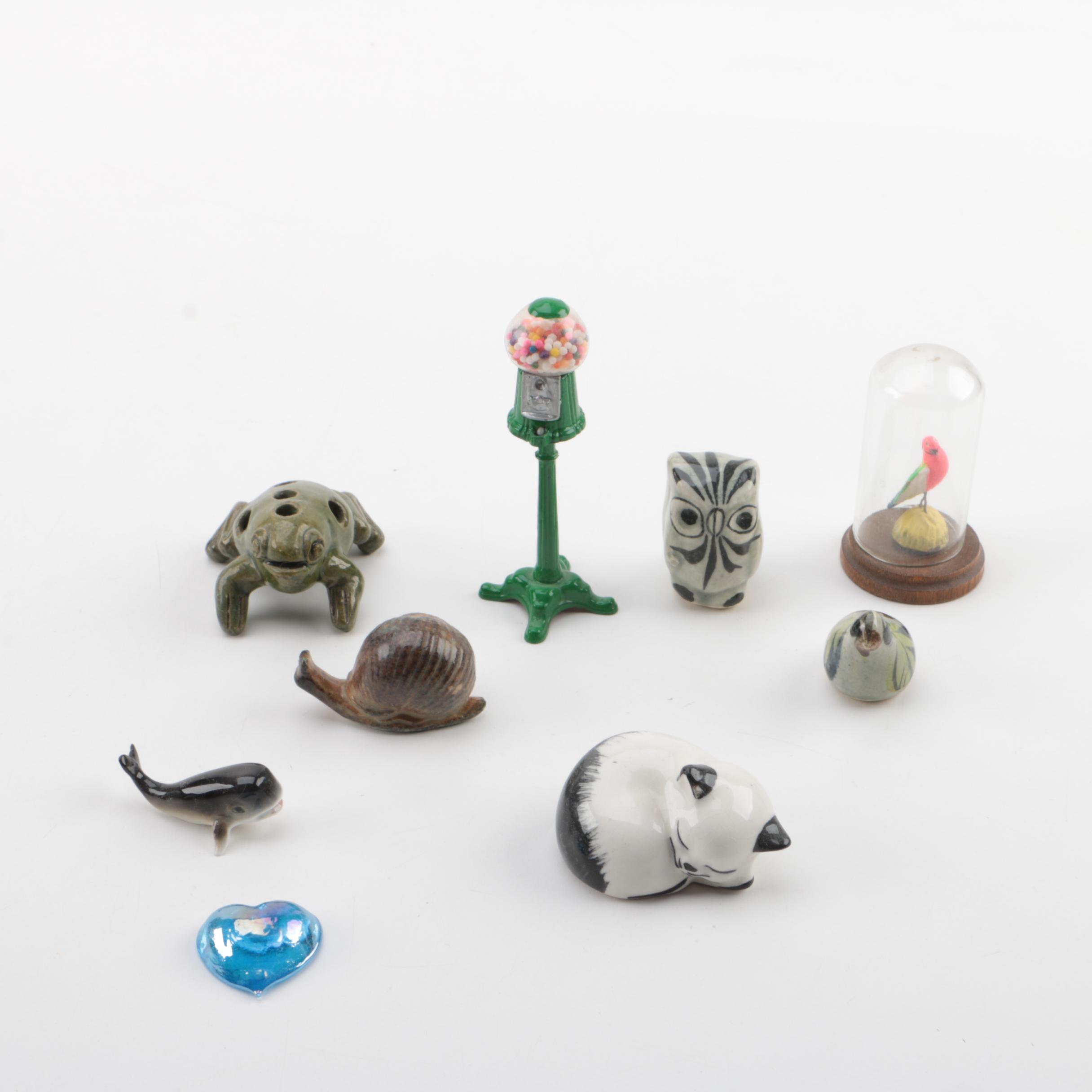 Vintage Figurines Featuring Goebel and a Display Shelf