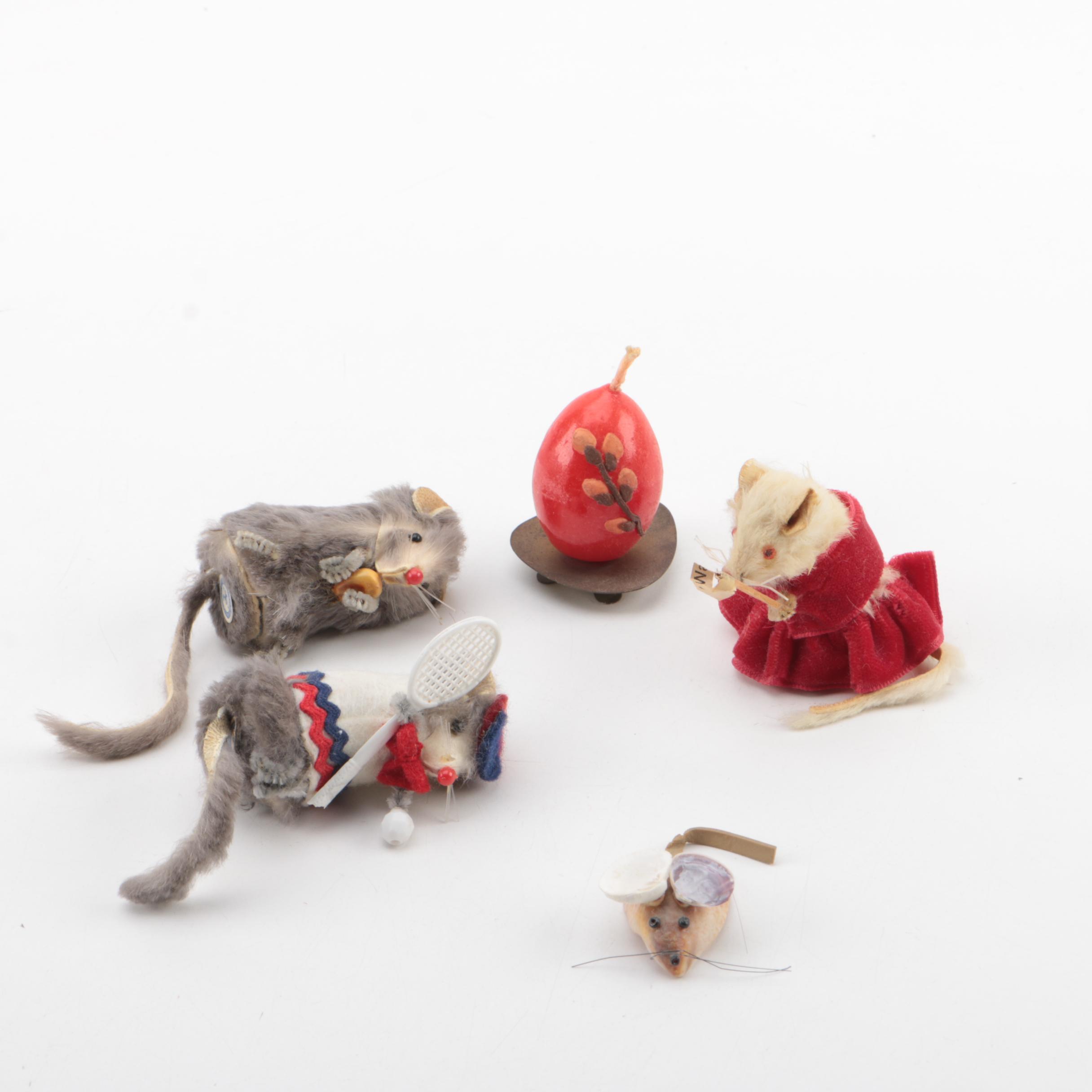 Vintage Figurines Featuring Goebel and a Display Shelf