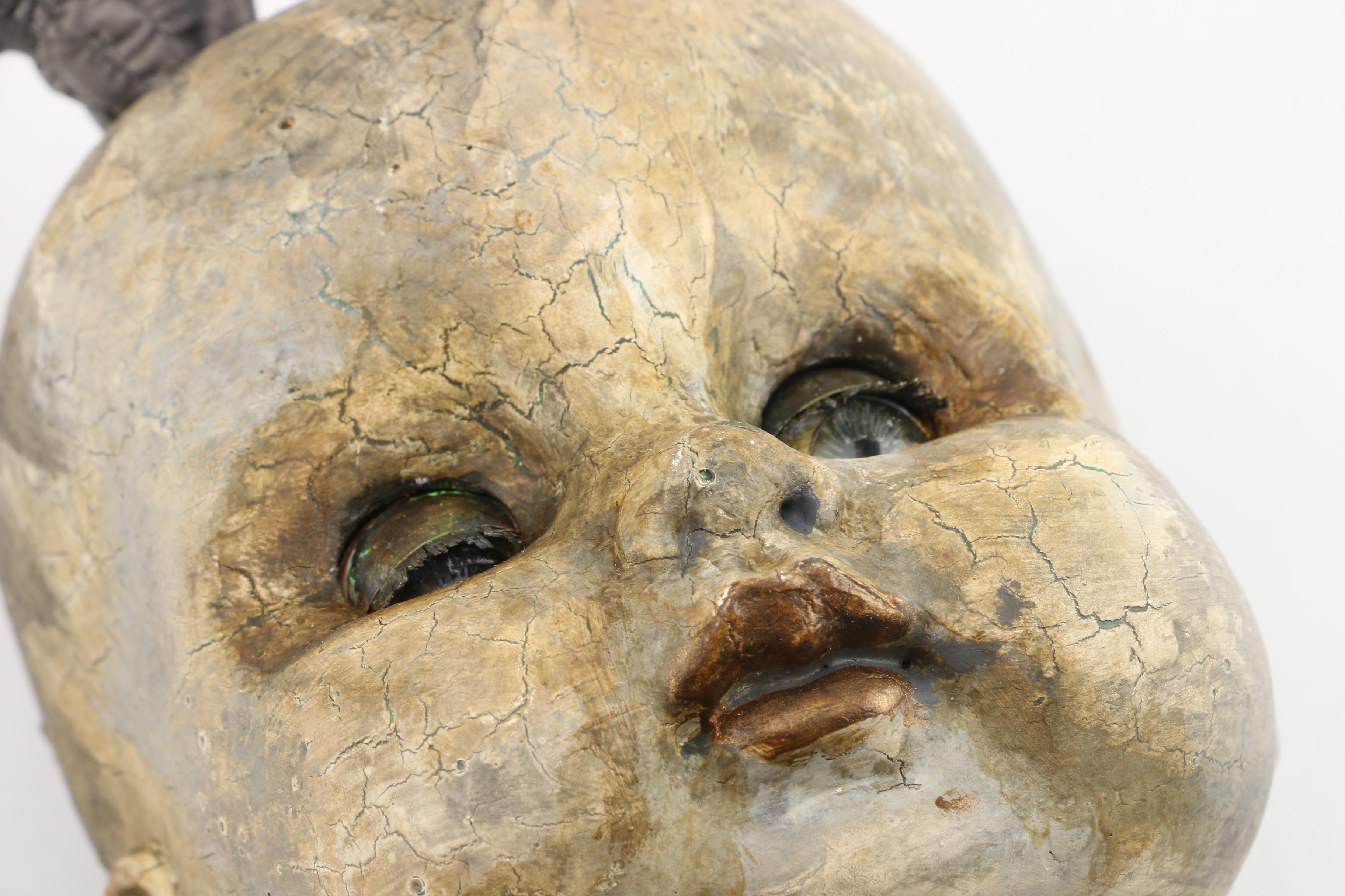 Doll Head Sculptures on Stands