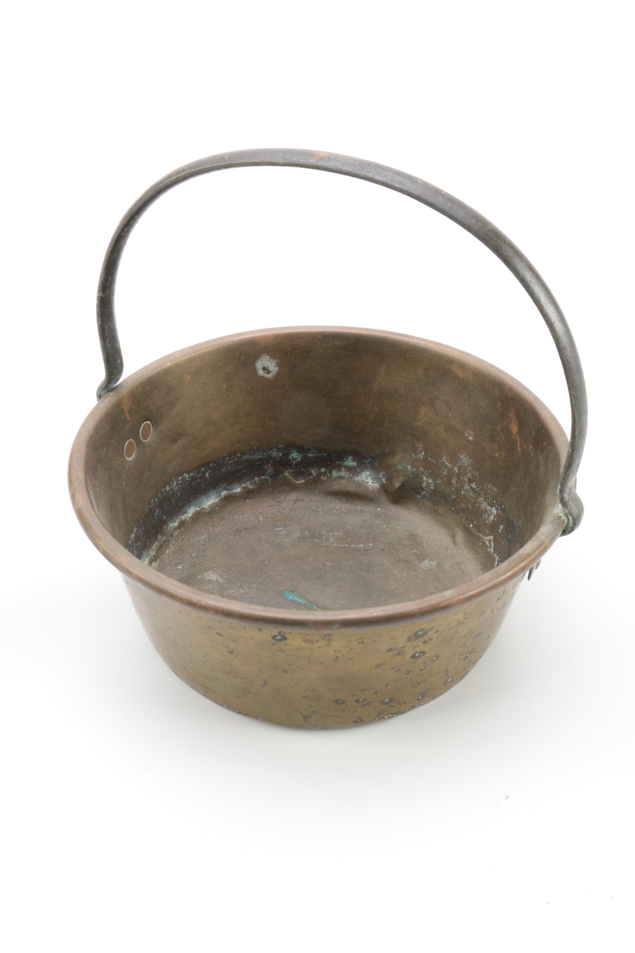 Brass and Copper Containers and a Candlestick