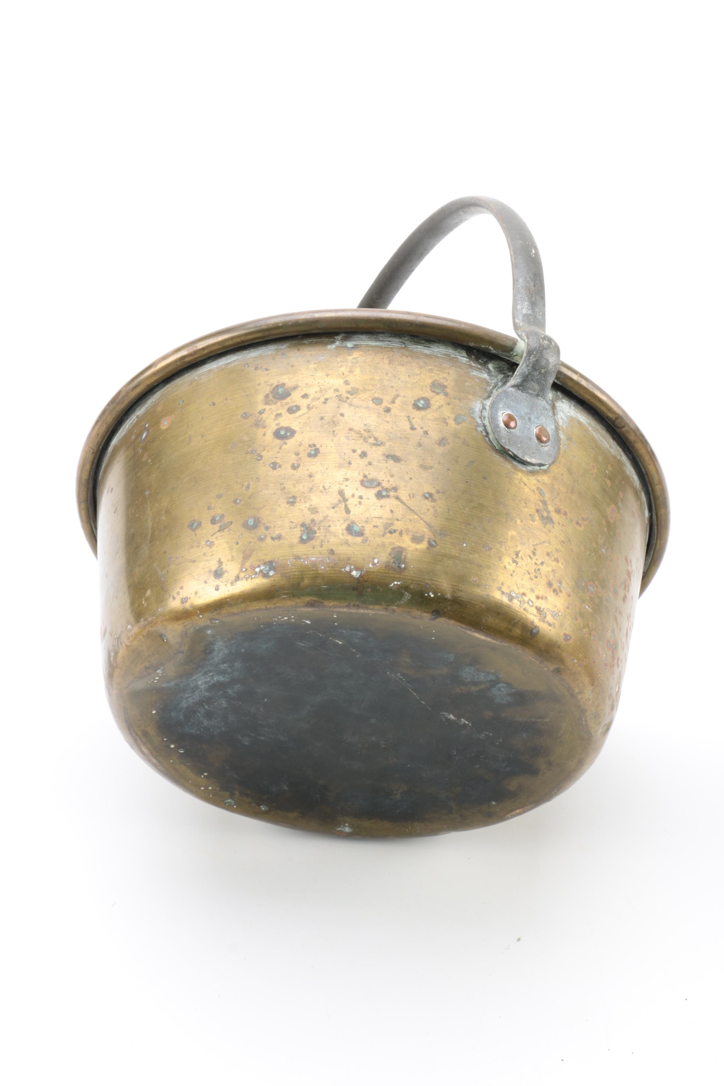 Brass and Copper Containers and a Candlestick