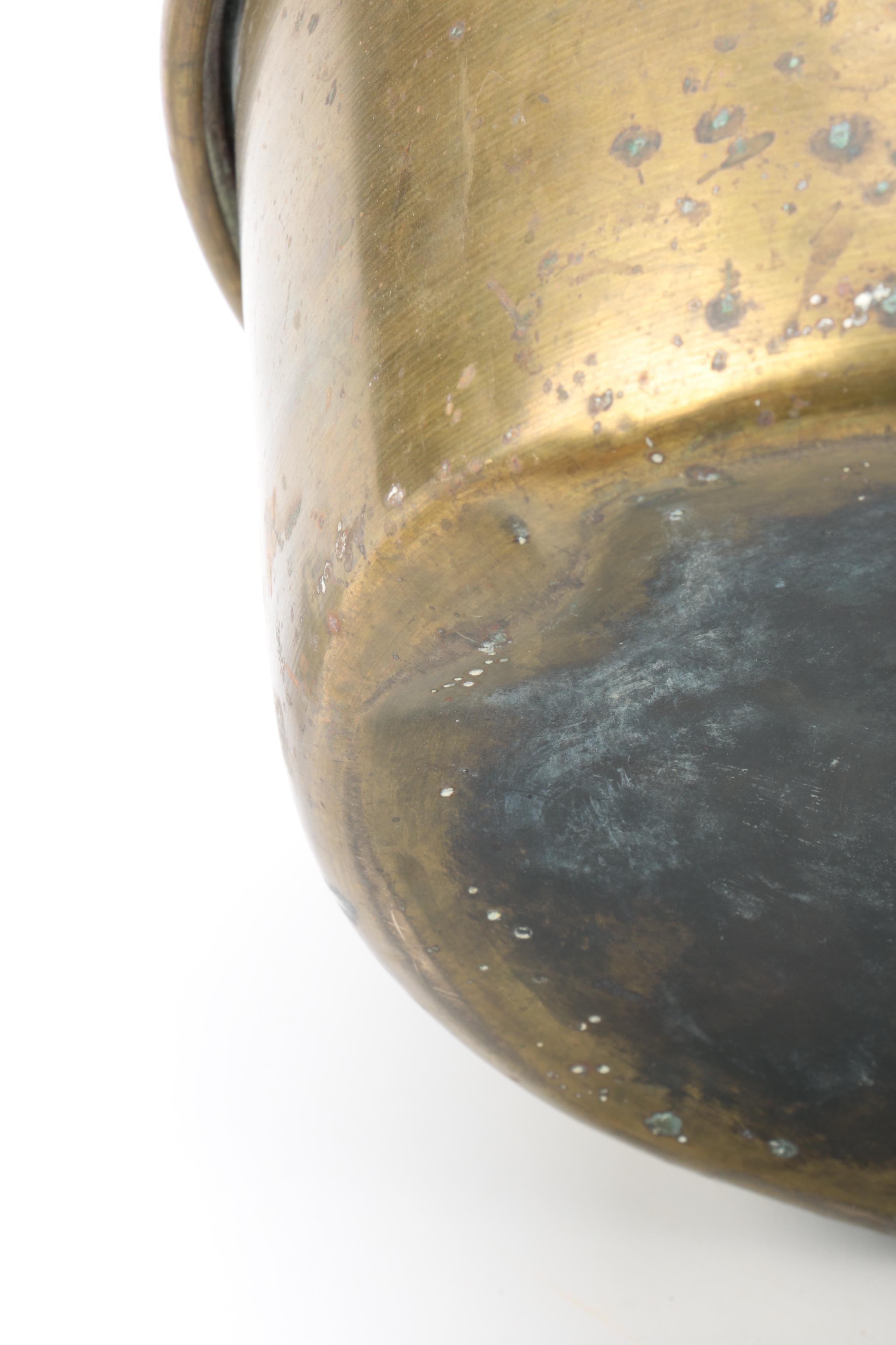 Brass and Copper Containers and a Candlestick