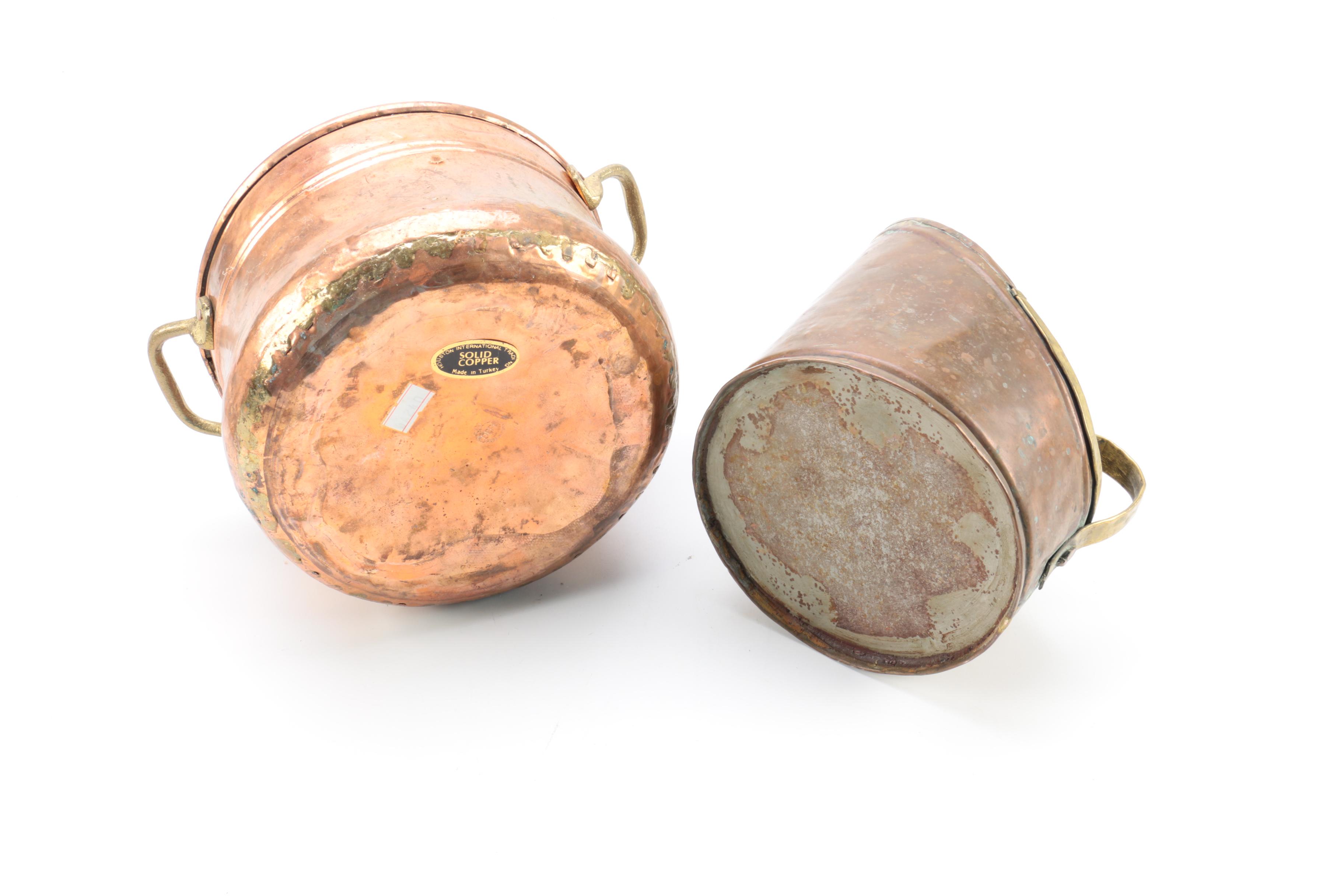 Brass and Copper Containers and a Candlestick