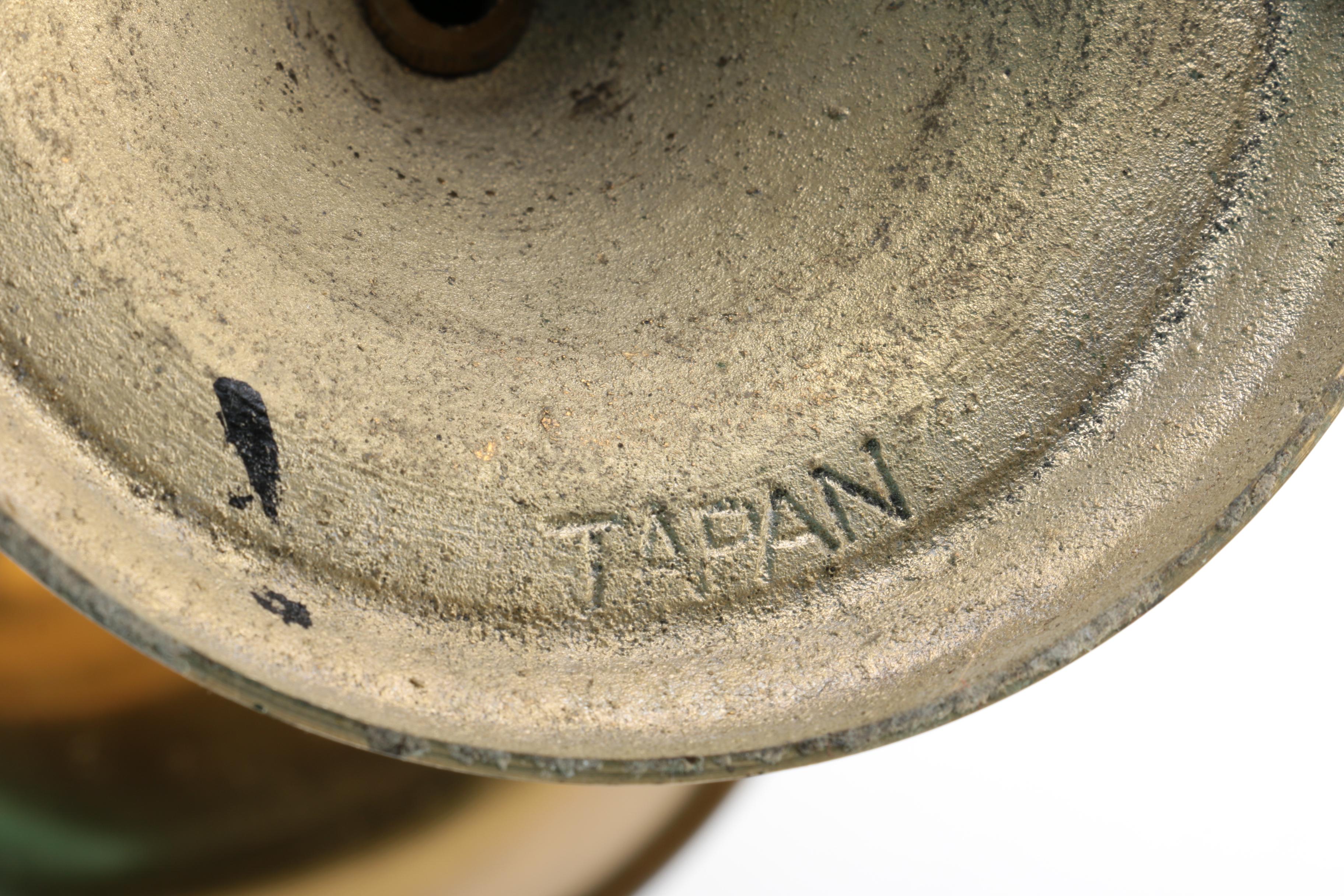 Brass and Copper Containers and a Candlestick