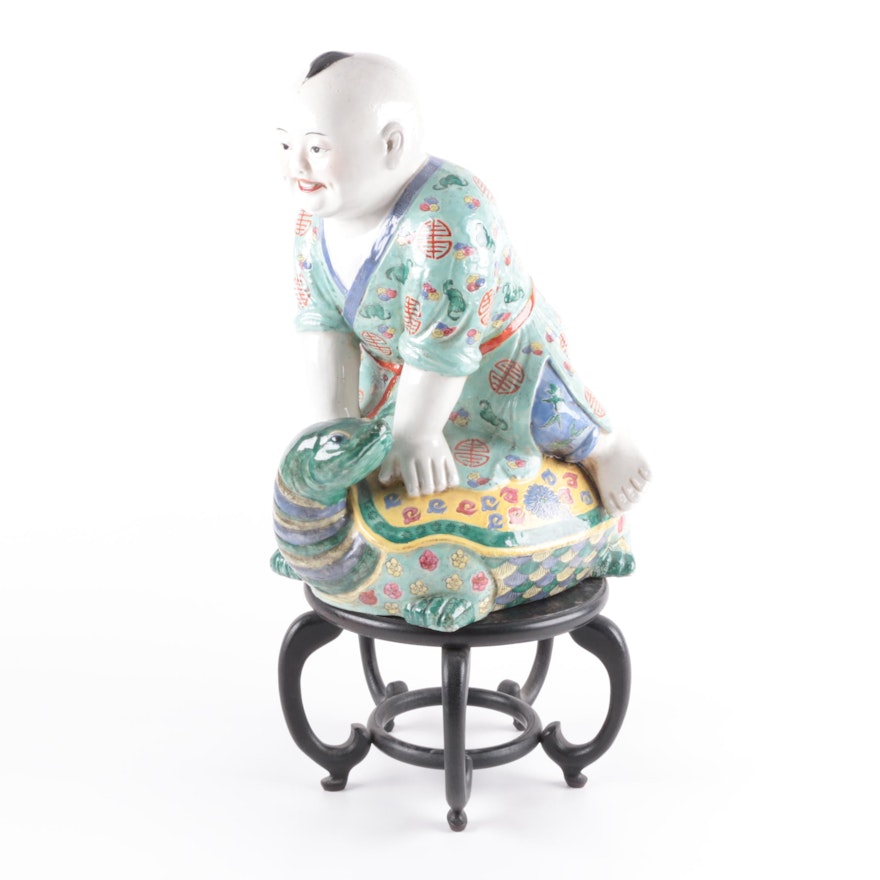 Chinese Figurine of Boy on Turtle with Wood Stand