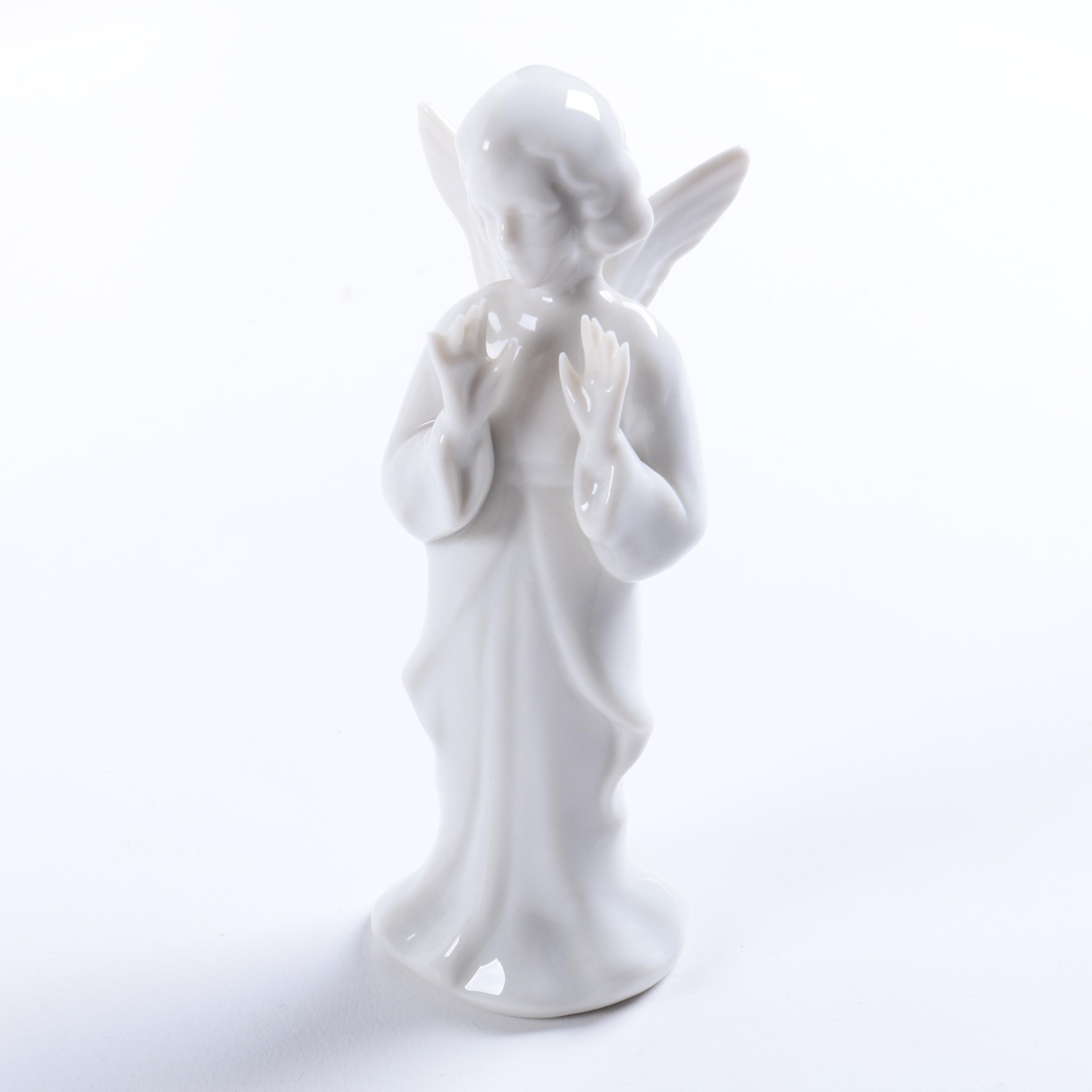 Collection of Eight Dresden Angel Figurines