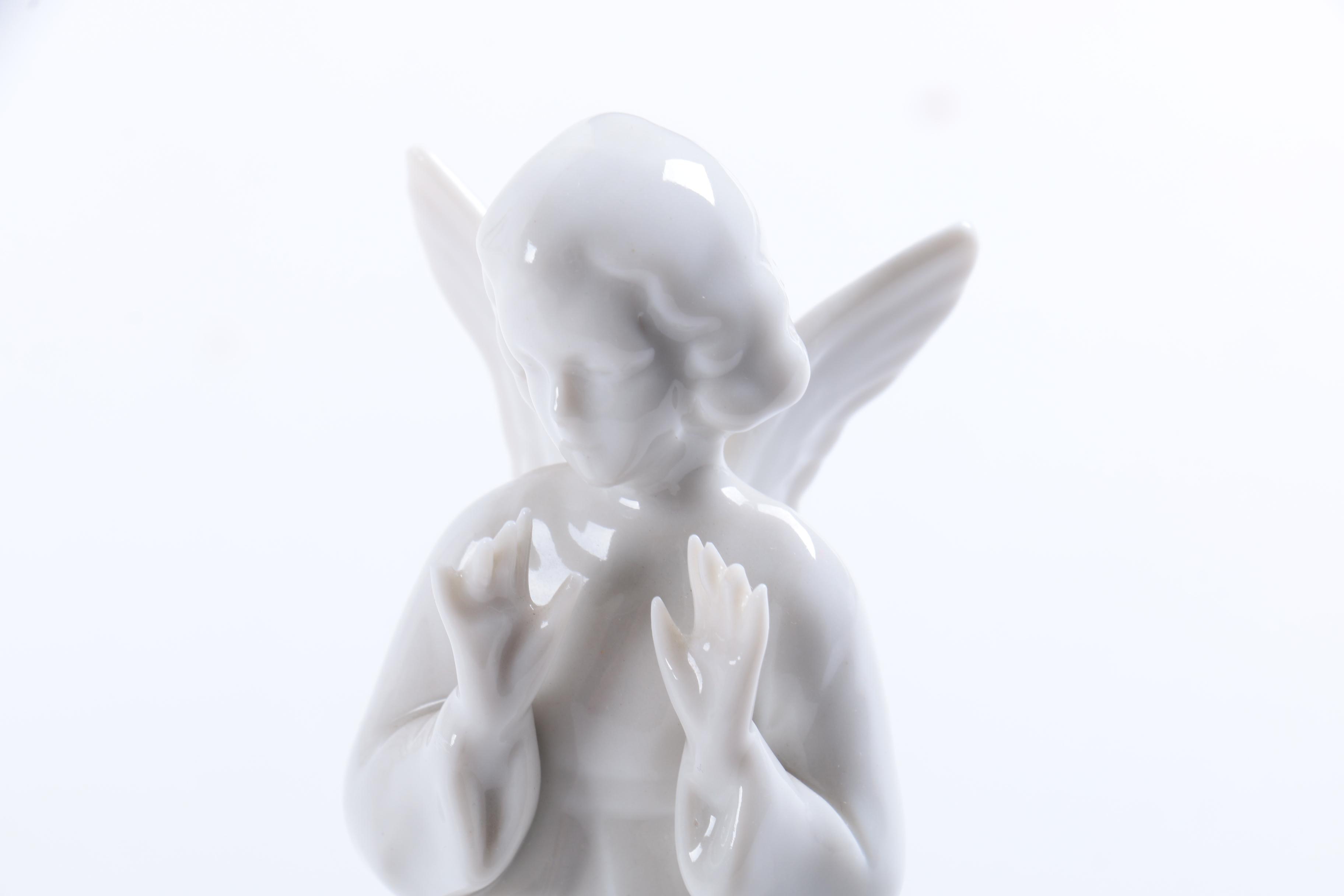 Collection of Eight Dresden Angel Figurines