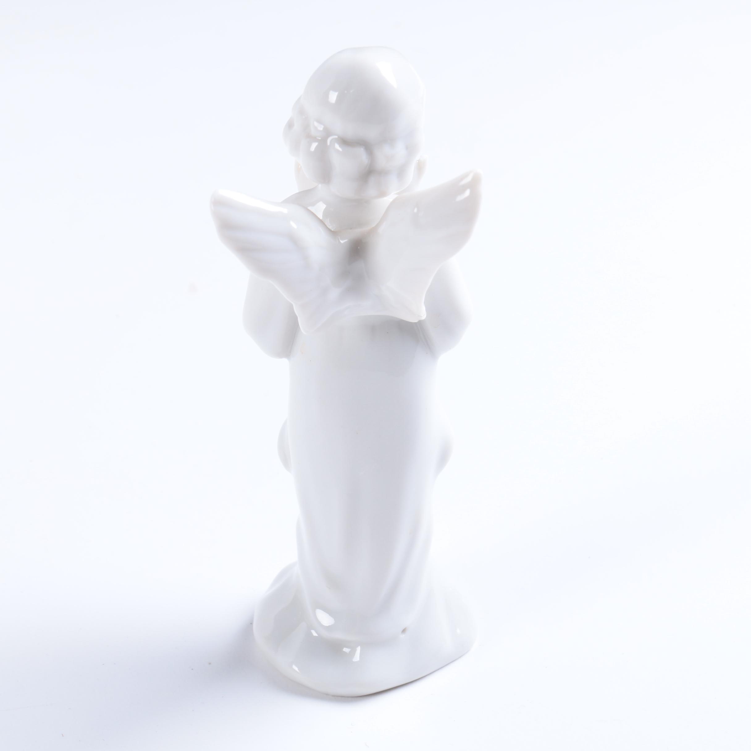 Collection of Eight Dresden Angel Figurines