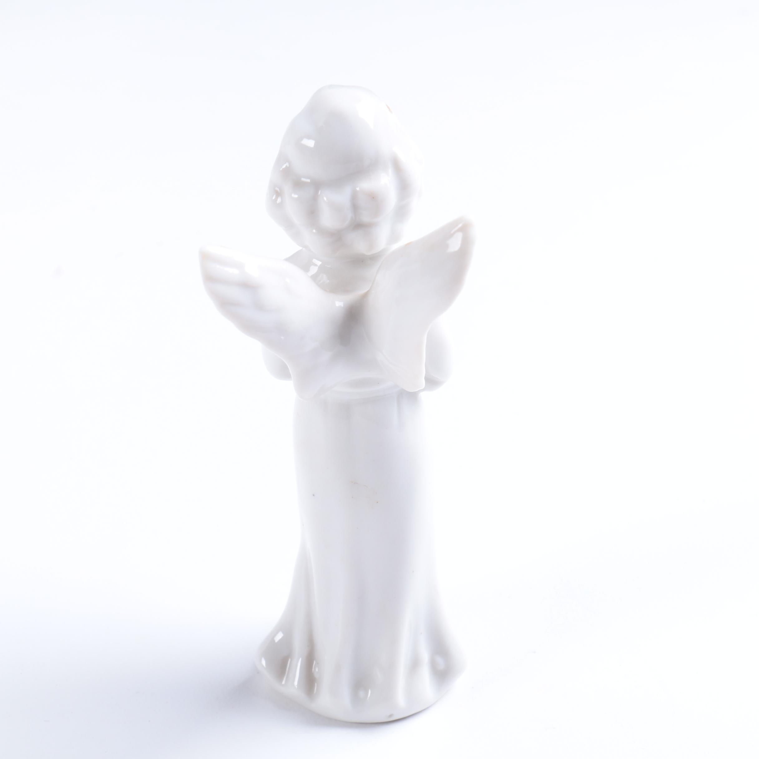 Collection of Eight Dresden Angel Figurines
