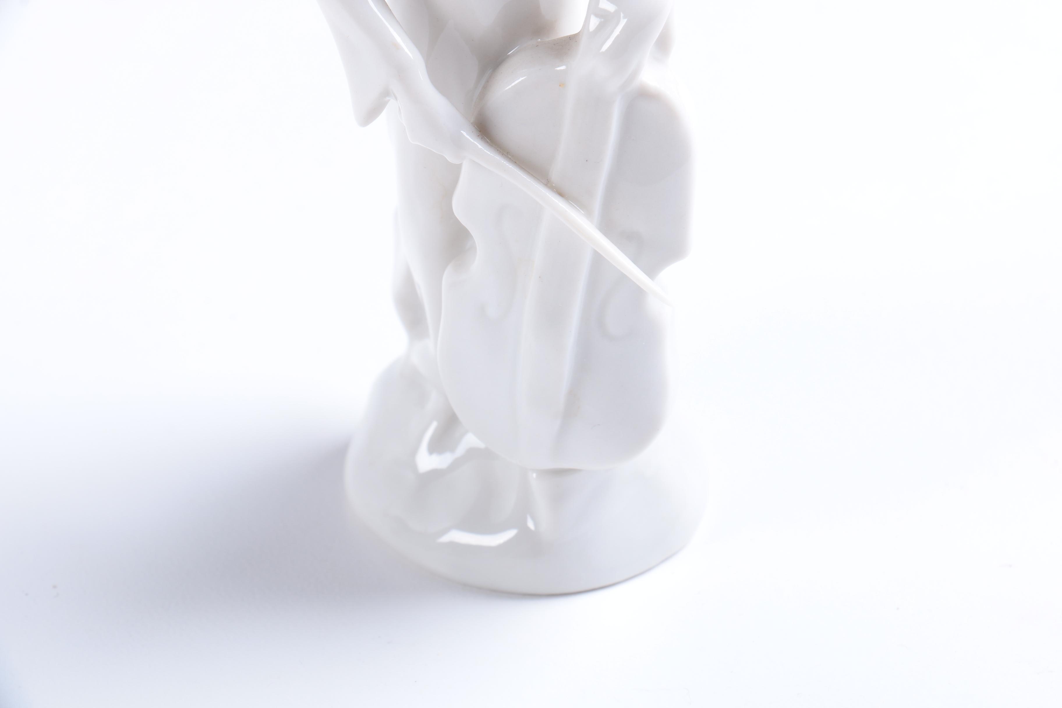 Collection of Eight Dresden Angel Figurines