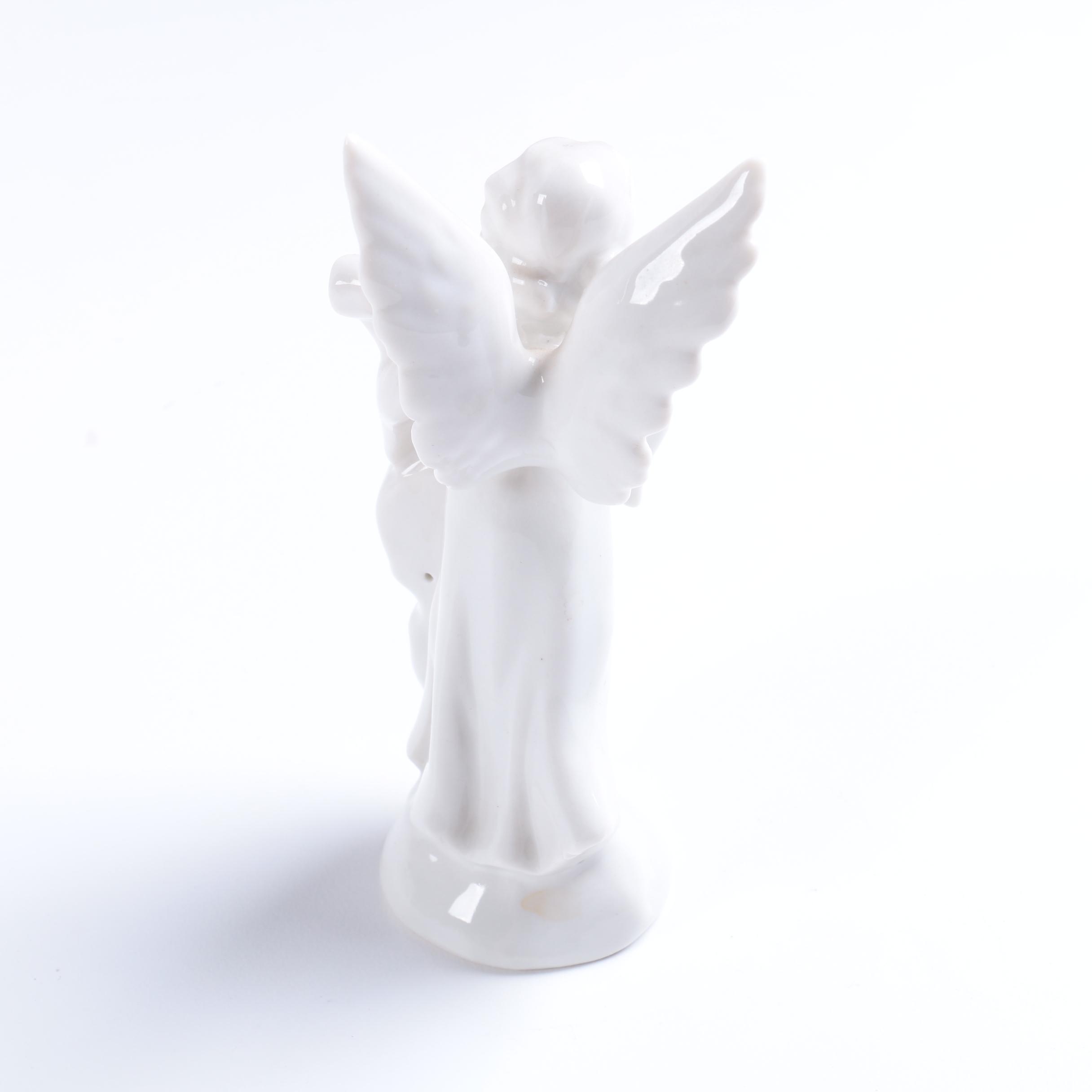 Collection of Eight Dresden Angel Figurines