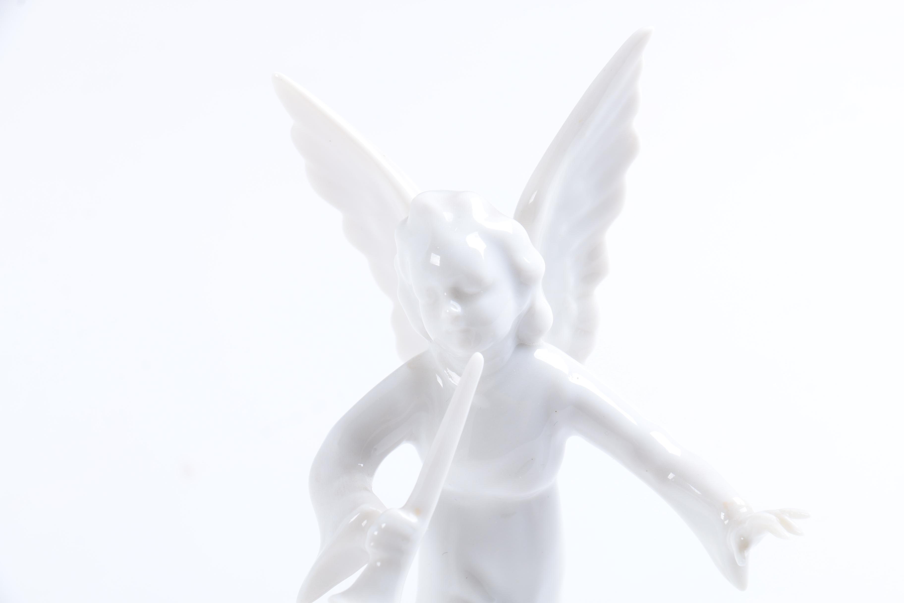 Collection of Eight Dresden Angel Figurines